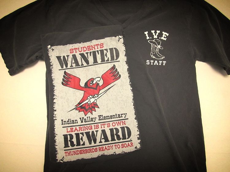 Black elementary school shirt with a red bird mascot and school lettering.