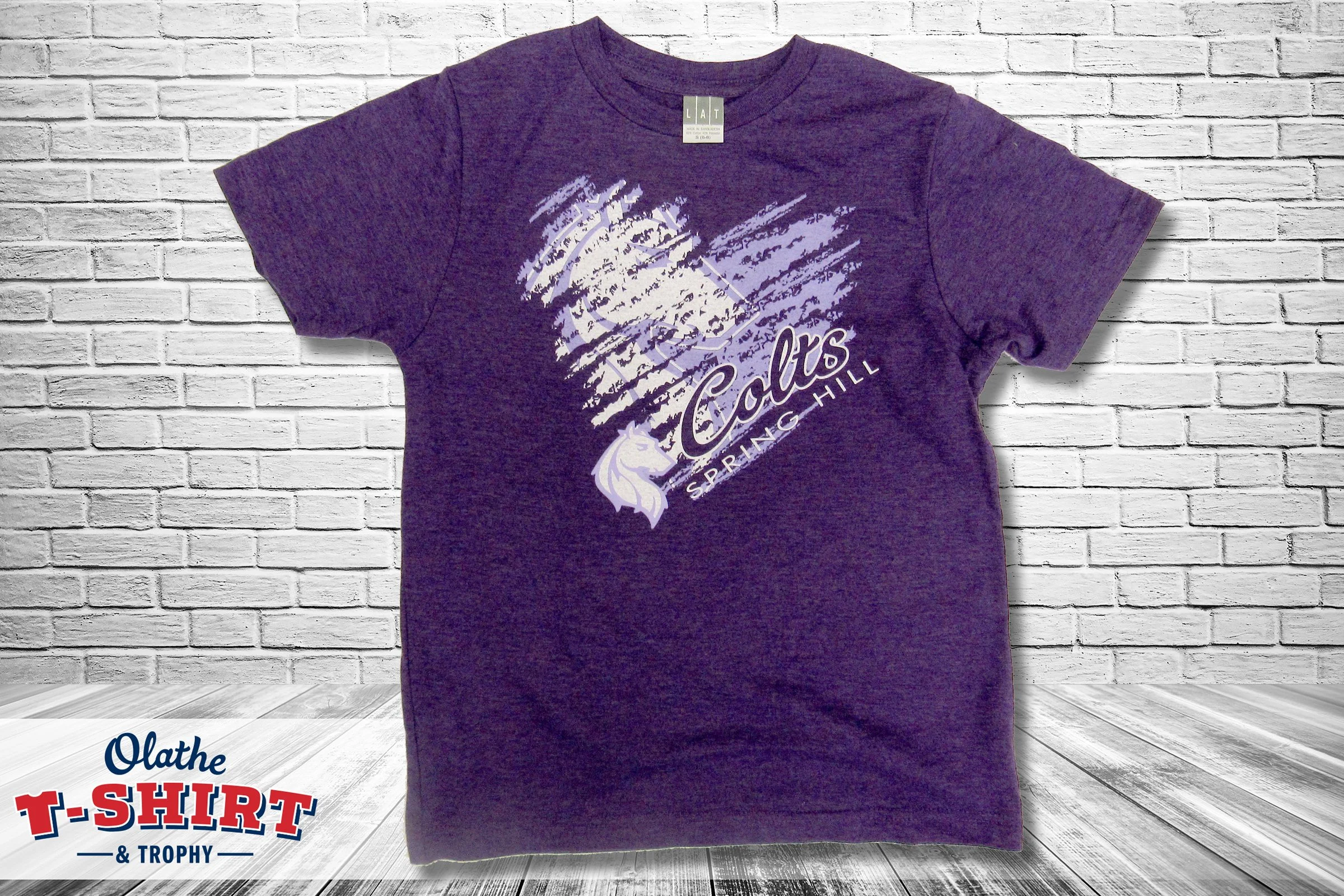 Purple Colts shirt with a horse-head mascot and white lettering.