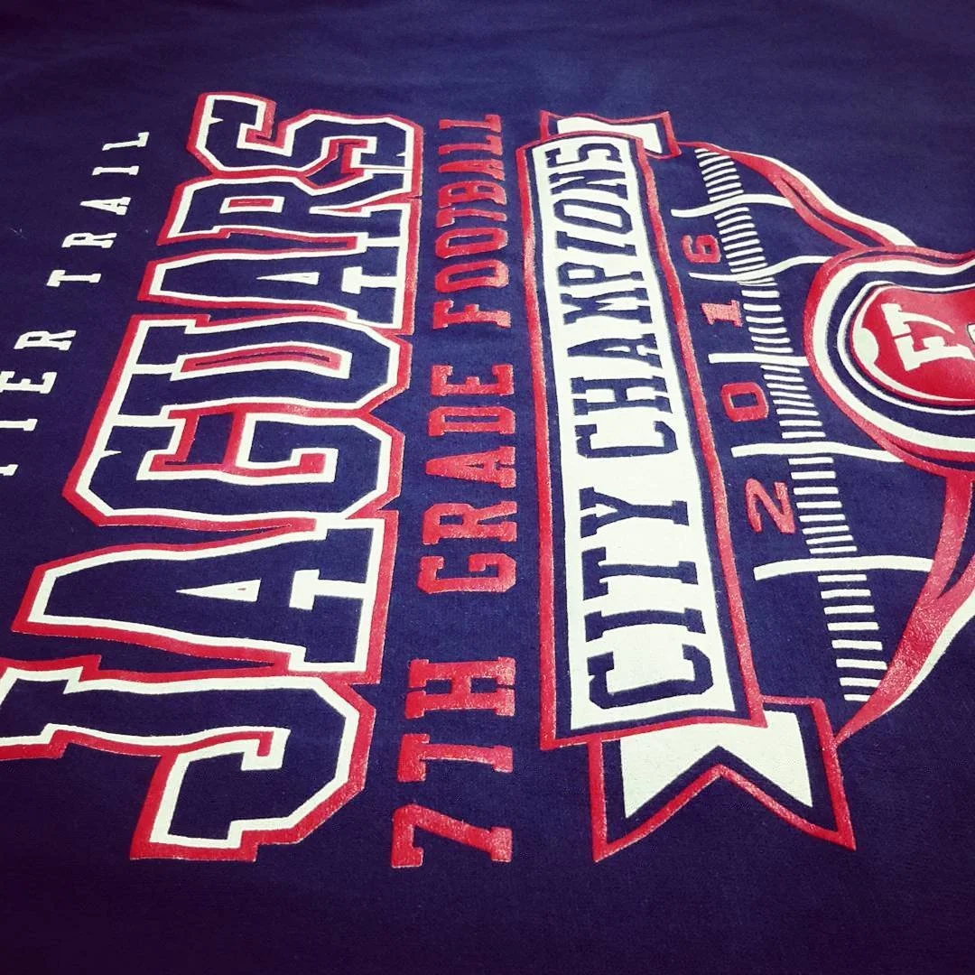 Close-up of red, white and blue soccer graphics on fabric.