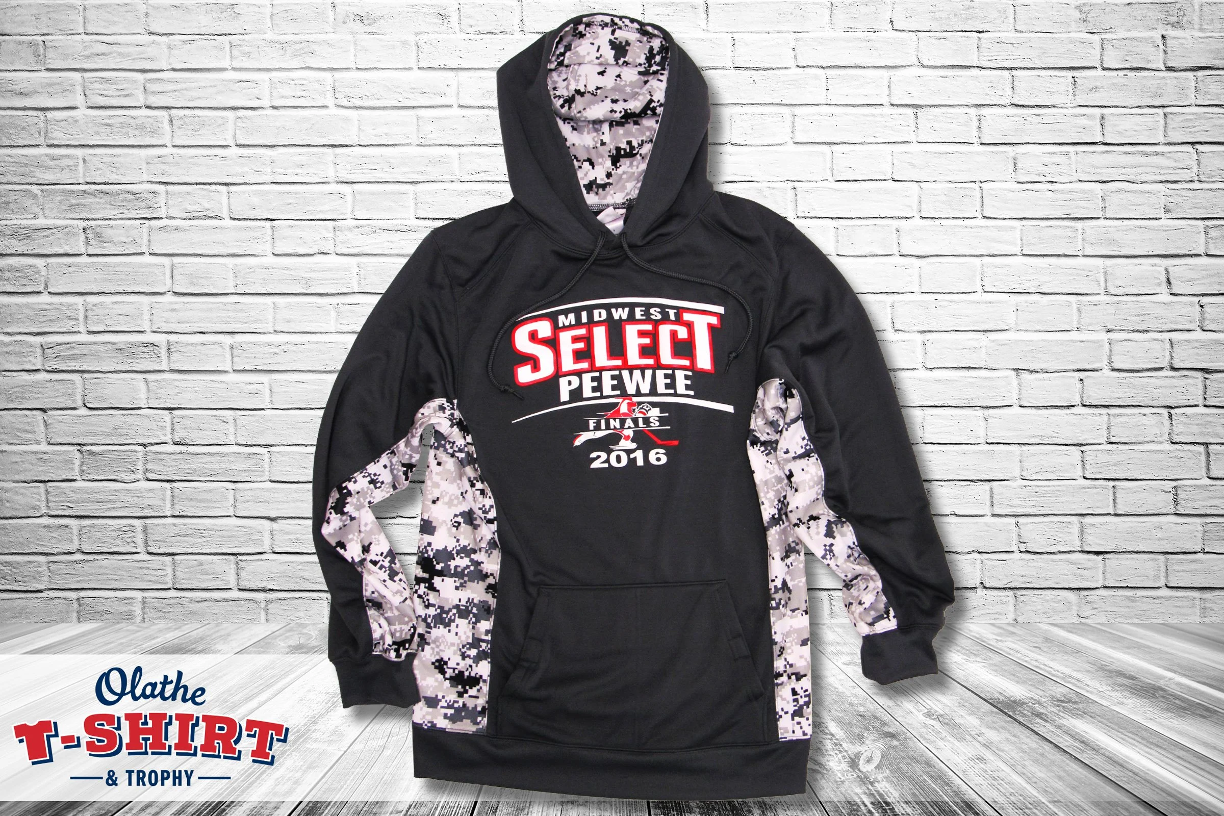 Black hoodie with camouflage hood lining and chest lettering.