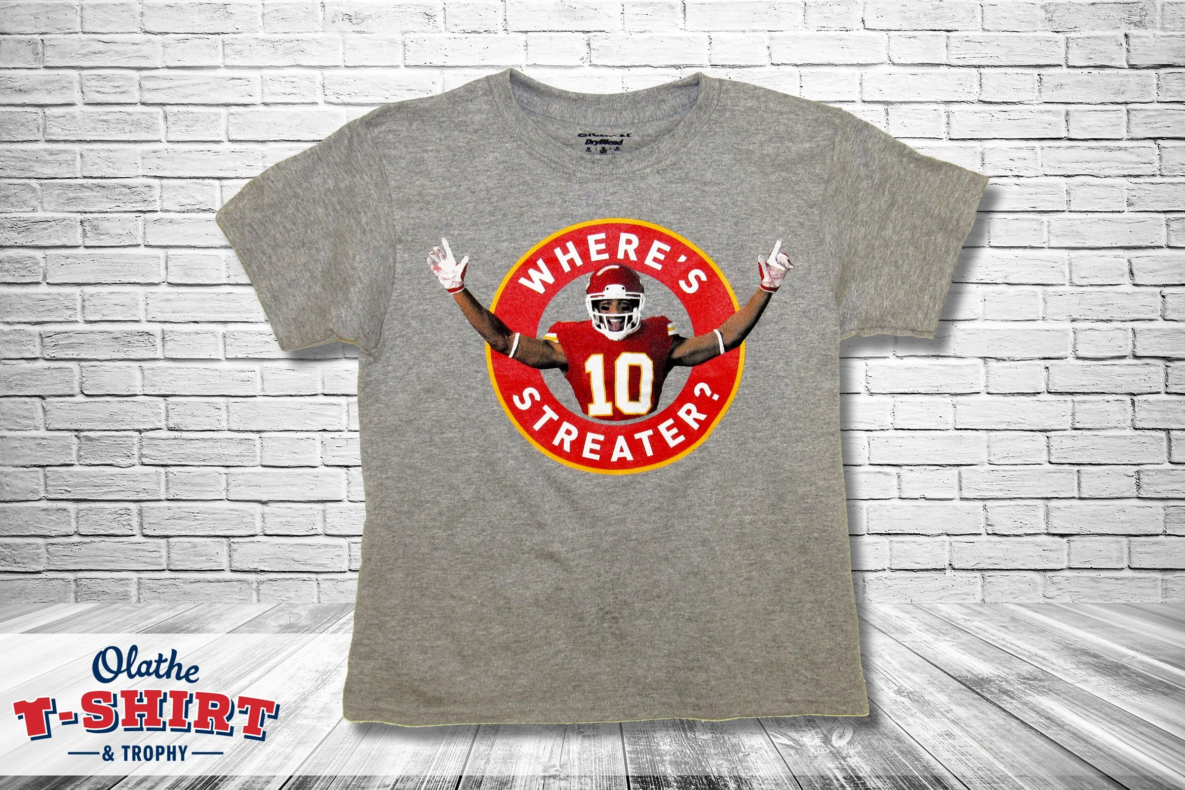 Light blue event shirt with coordinating text and graphics.