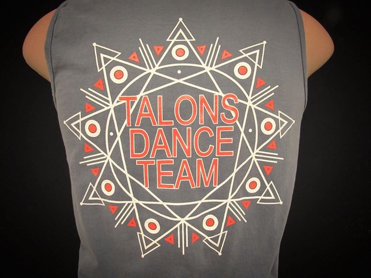 Back of a shirt with geometric design and the text 'TALONS DANCE TEAM' printed in the center.