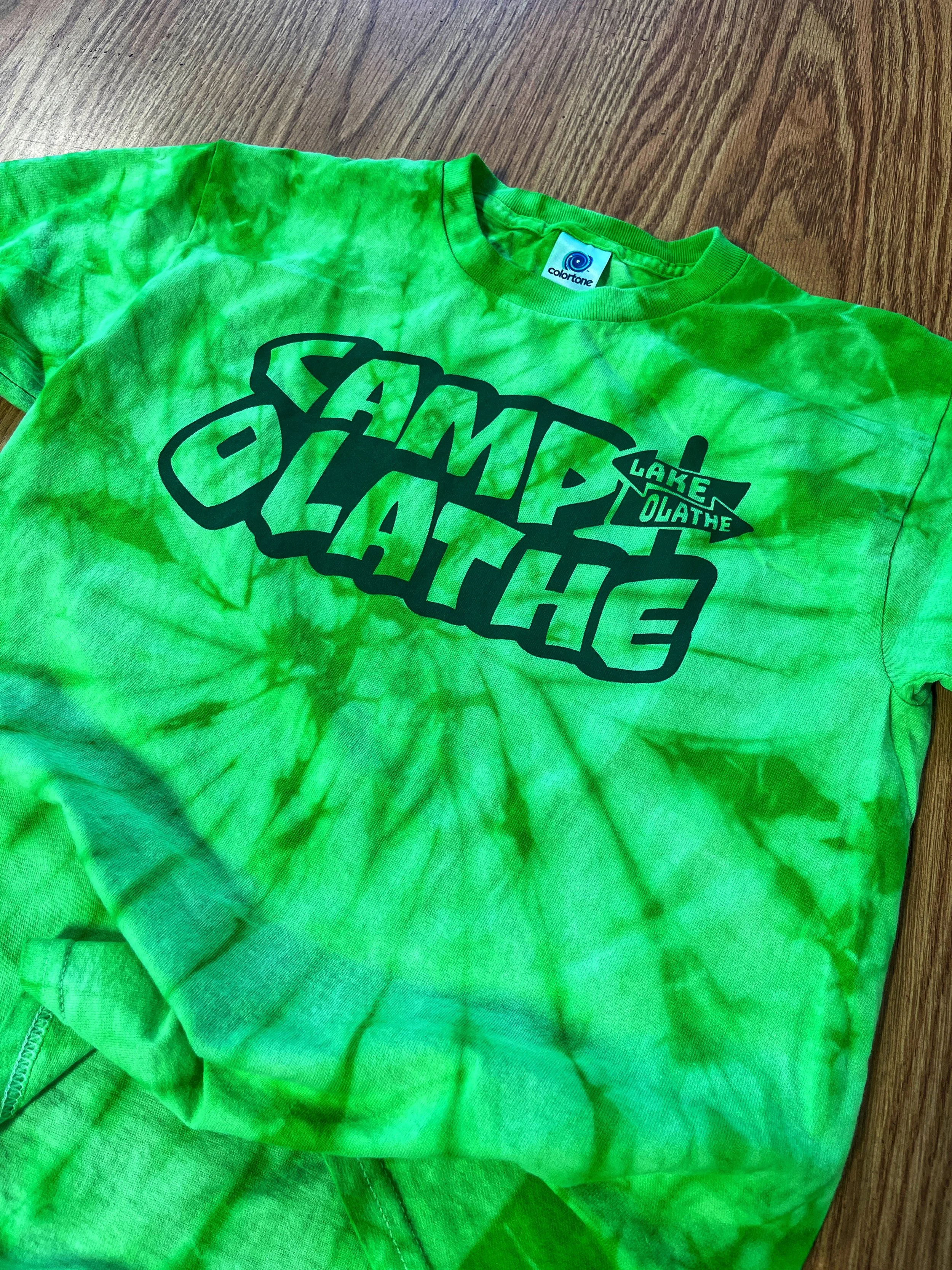 Bright green tie-dye T-shirt with black lettering.