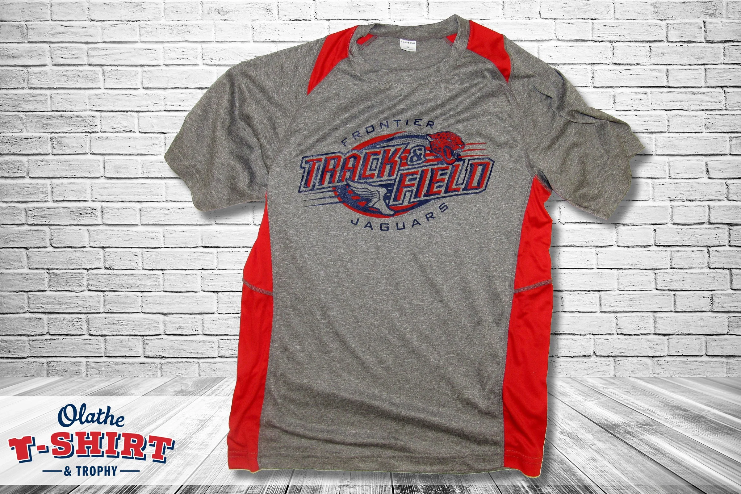 Gray sleeveless shirt with a small white chest design.