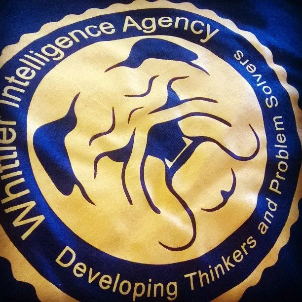Close-up of the Middle Eastern Intelligence Agency emblem with a lion illustration and descriptive text.