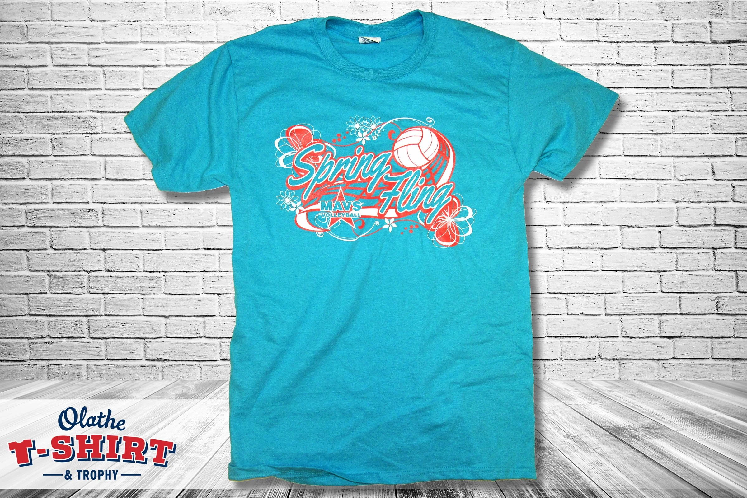 Gray T-shirt with an illustrated football player and red and yellow graphic.