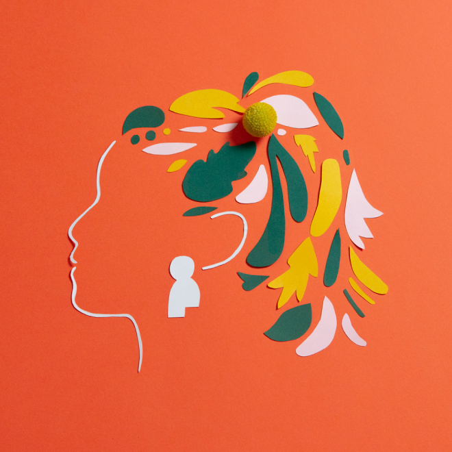 An artistic illustration of a human head outline with hair made of colored paper cutouts in yellow, green, and white, placed on an orange background. A small, round, yellow textured object is positioned at the top of the head.