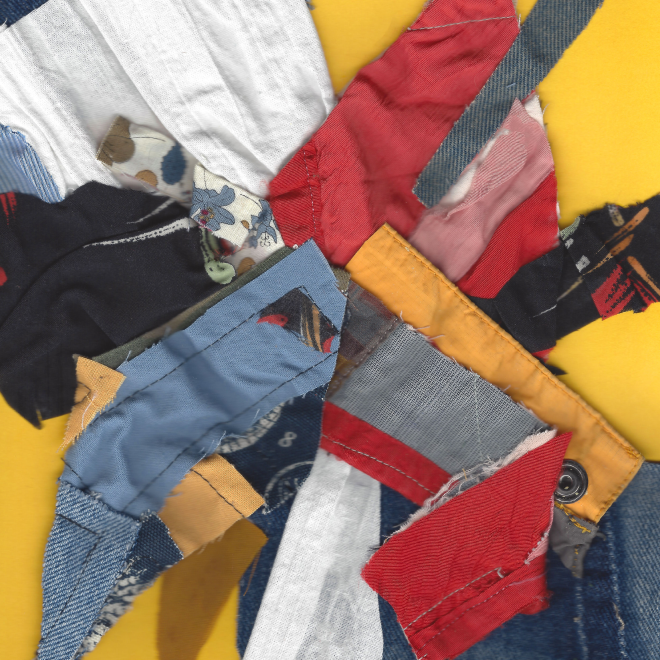 A pile of various colorful fabric scraps on a yellow background.