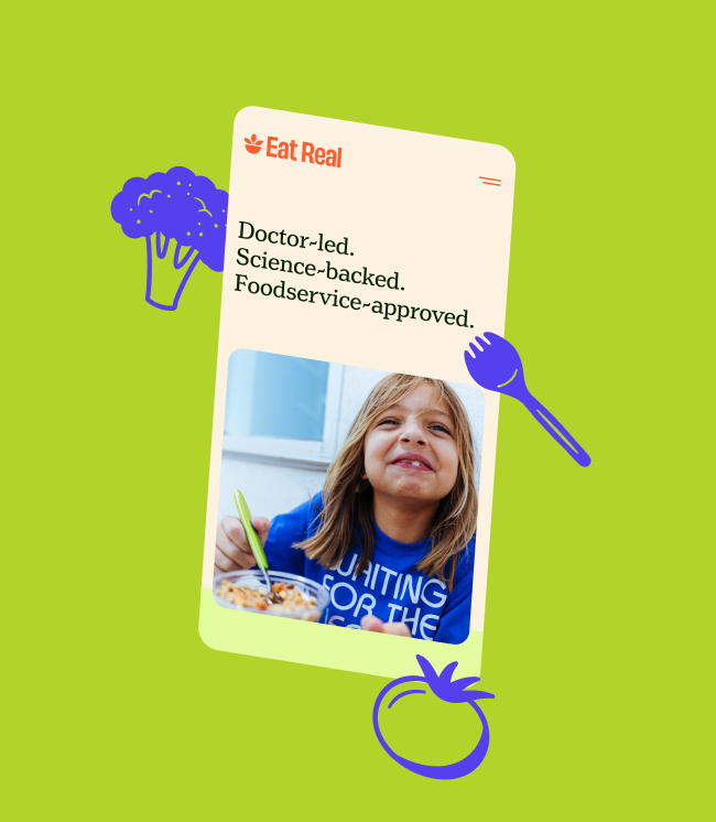 A promotional graphic for Eat Real features a child smiling while eating, on a green background, illustrations of broccoli, tomato, and a fork, and text highlighting that the food is doctor-led, science-backed, and foodservice-approved.