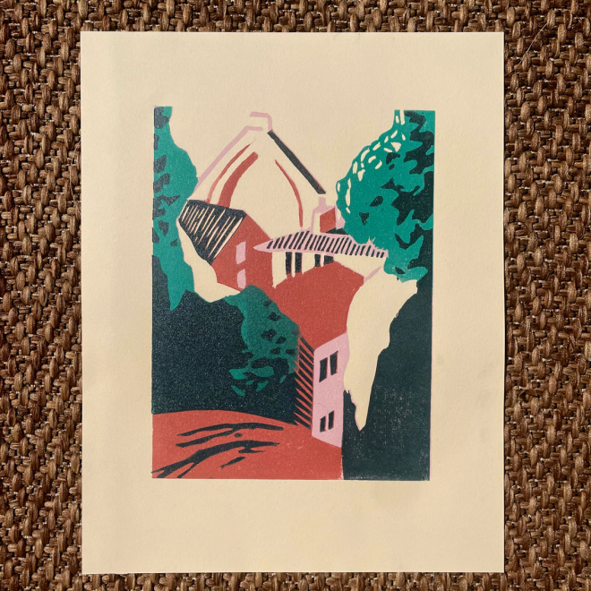 An abstract woodcut print of a house surrounded by trees, with a tower and slanted roof, depicted in muted colors of green, pink, red, and beige.