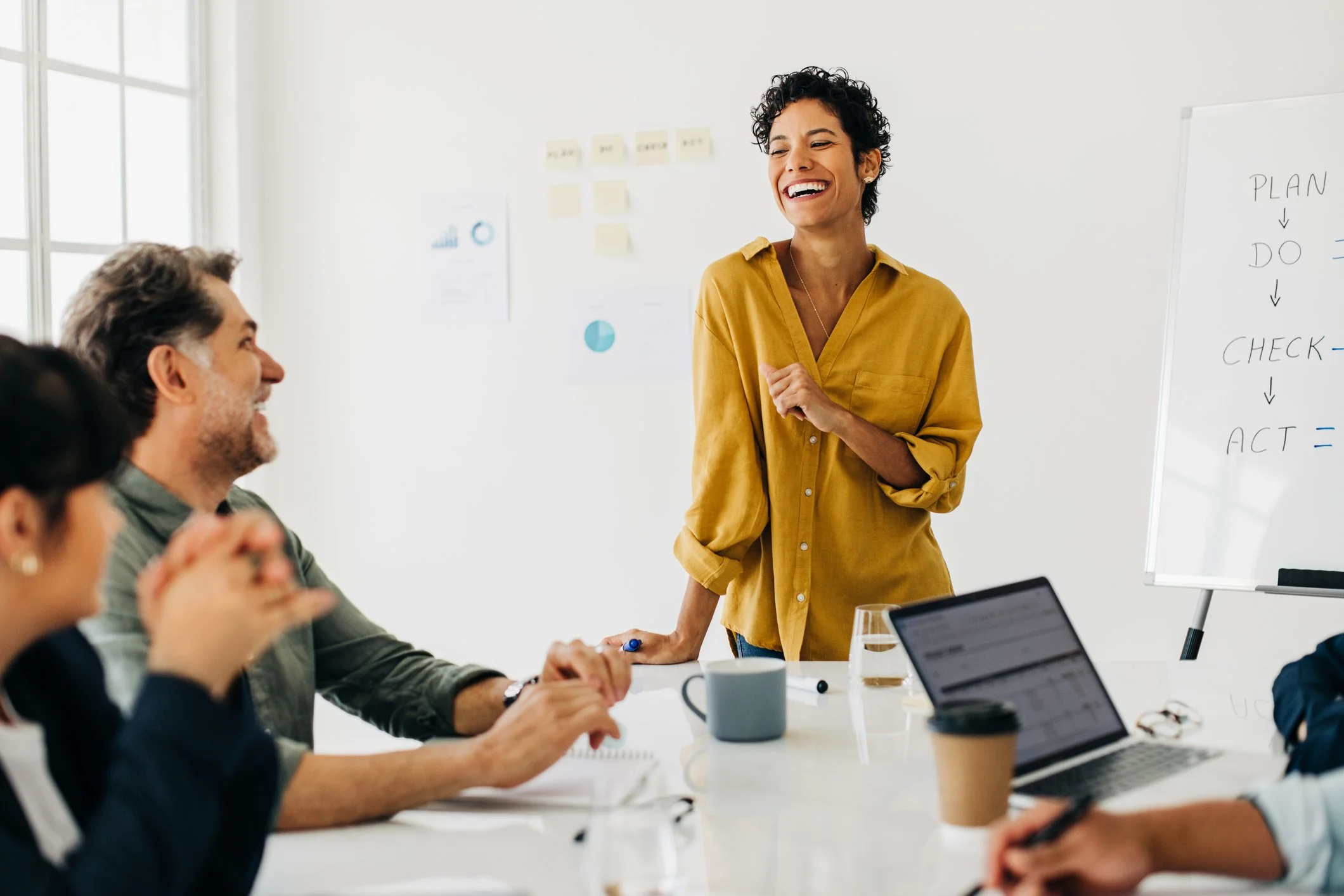 a woman leading a product design meeting with authentic presence