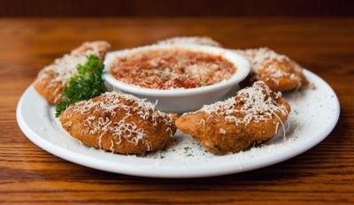 Plate of fried ravioli with marinara sauce