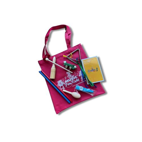 Pink tote bag filled with children's musical toys, a notebook, and a small toy car.
