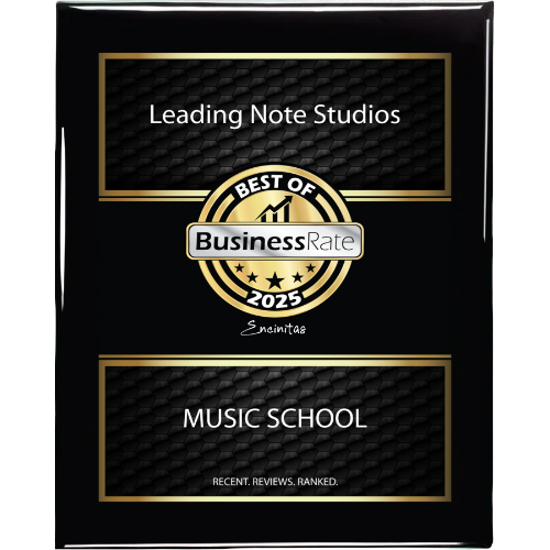Plaque or award plaque with black and gold design, titled 'Leading Note Studios,' recognizing as 'Best of Business Rate 2025' for music school, with recent reviews and ranking.