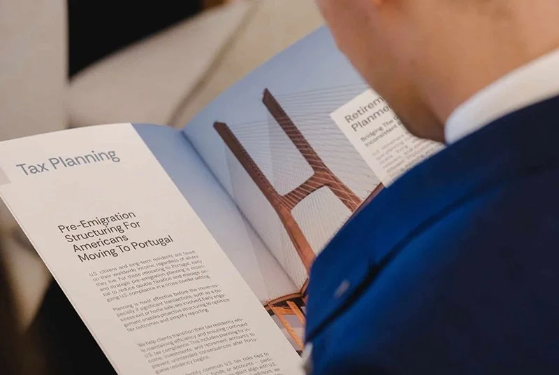 Person reading text on tax planning