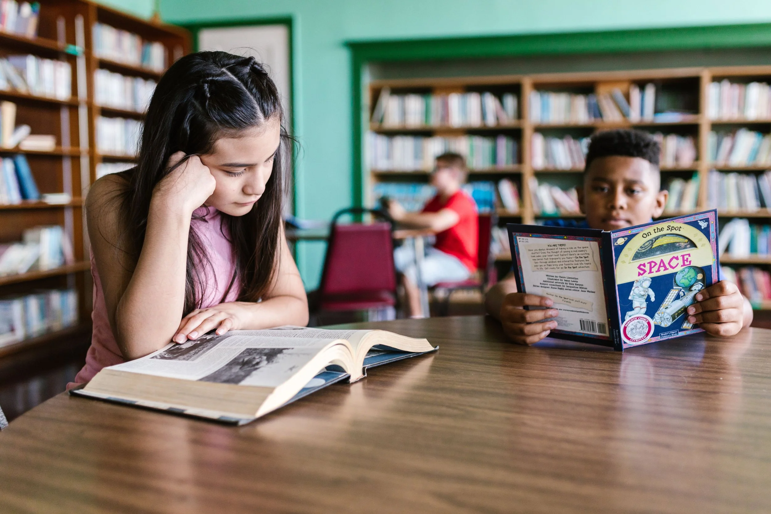 children reading books in the library