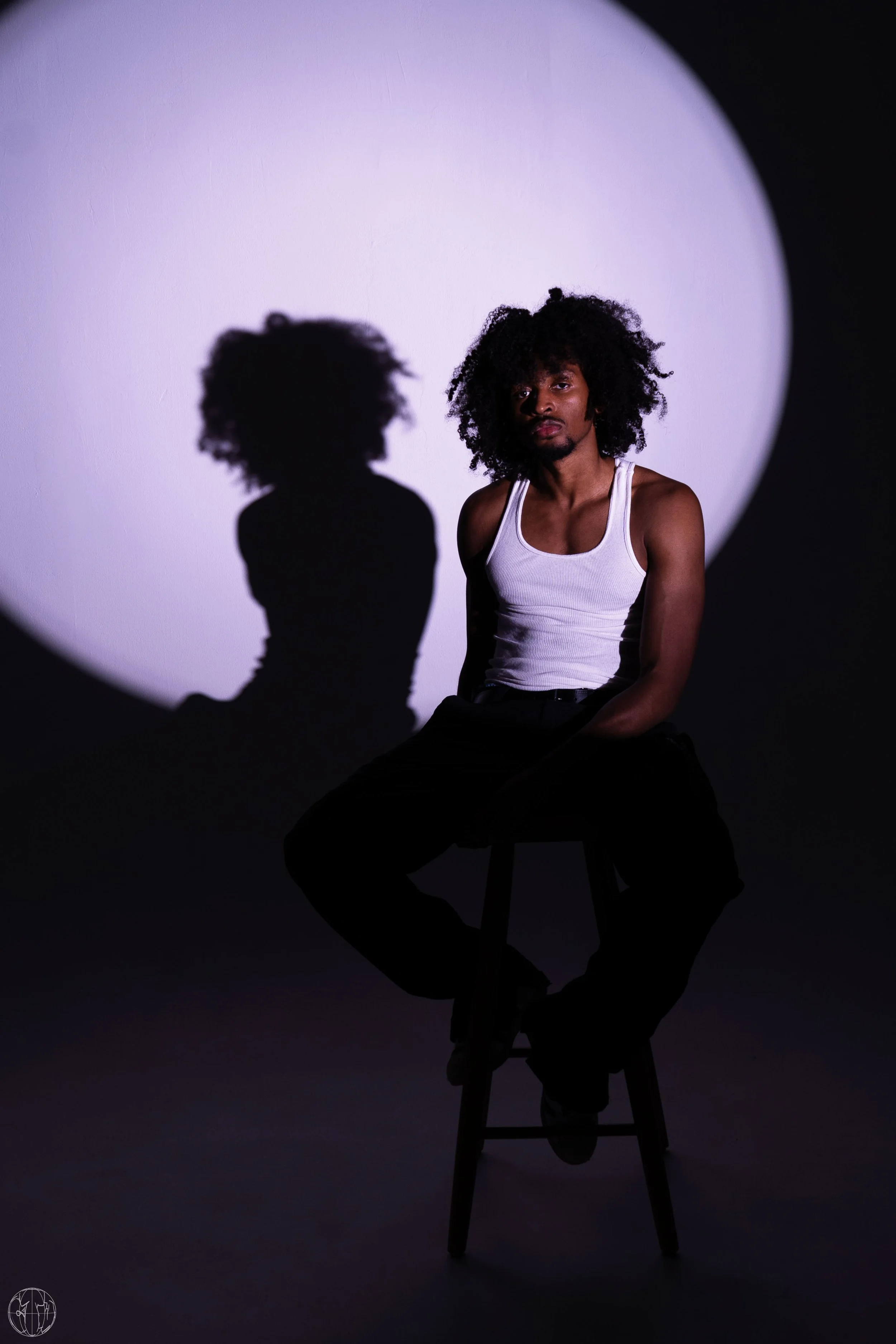picture of numbrs the singer sitting on stool.jpg