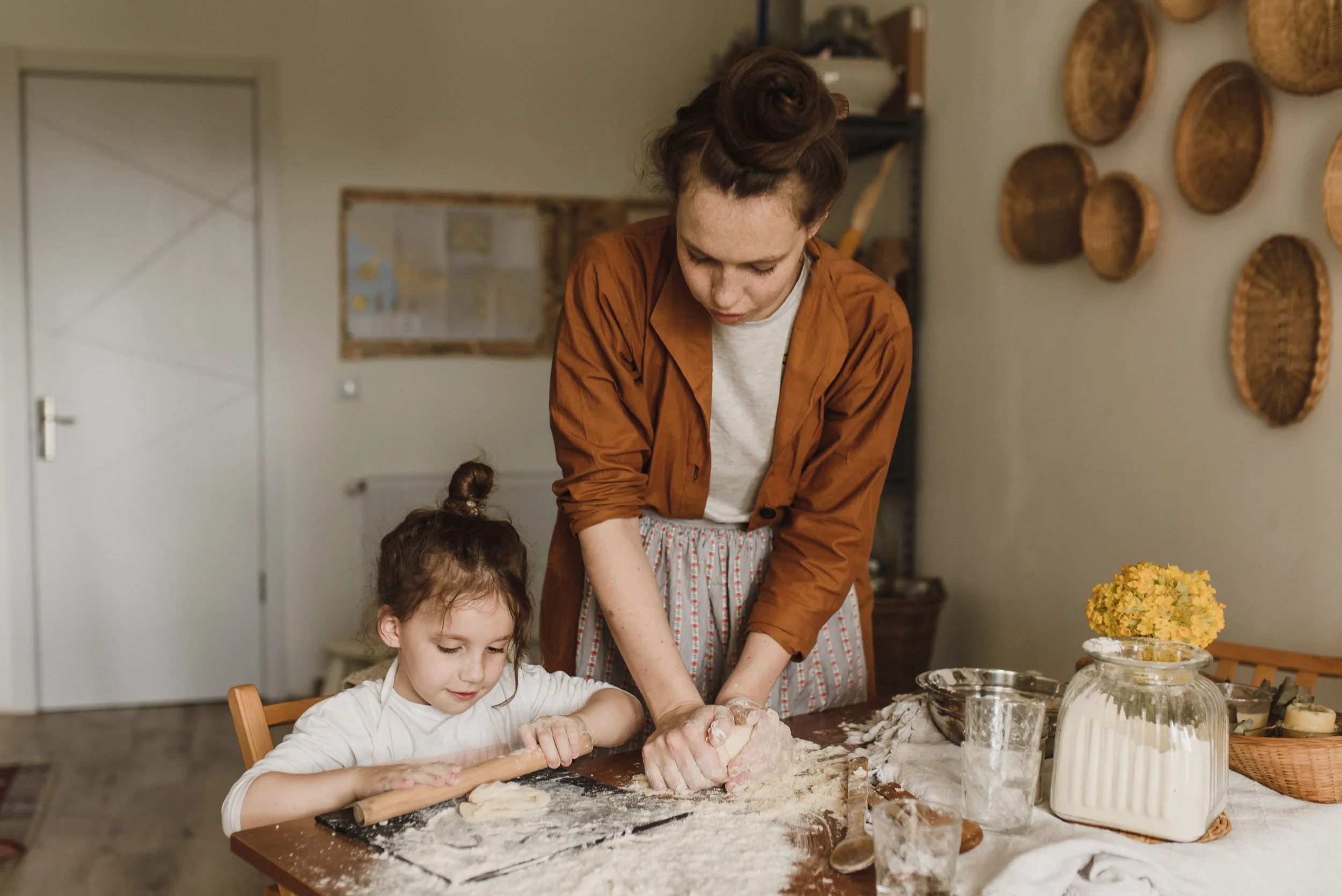 Family baking together in the kitchen during the fall season