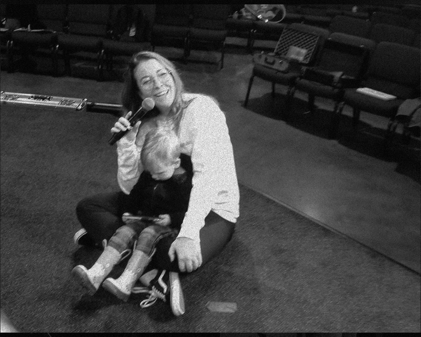 Mom with young child raising up in worship—about Heartstrings & Hymns for faith-filled home rhythms and worship in everyday life