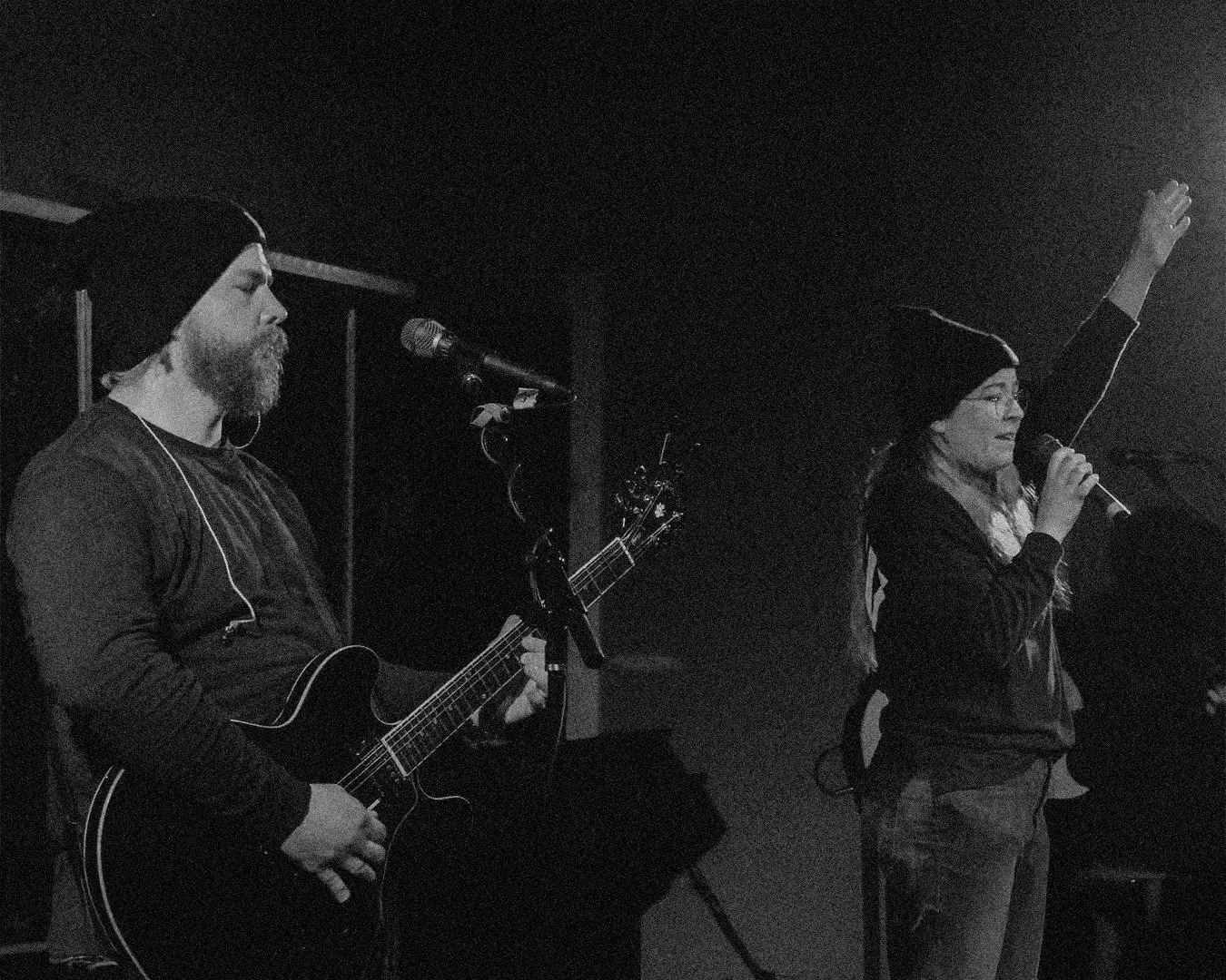 Young couple worshipping together—contact Heartstrings & Hymns for faith-filled home rhythms and worship in everyday life