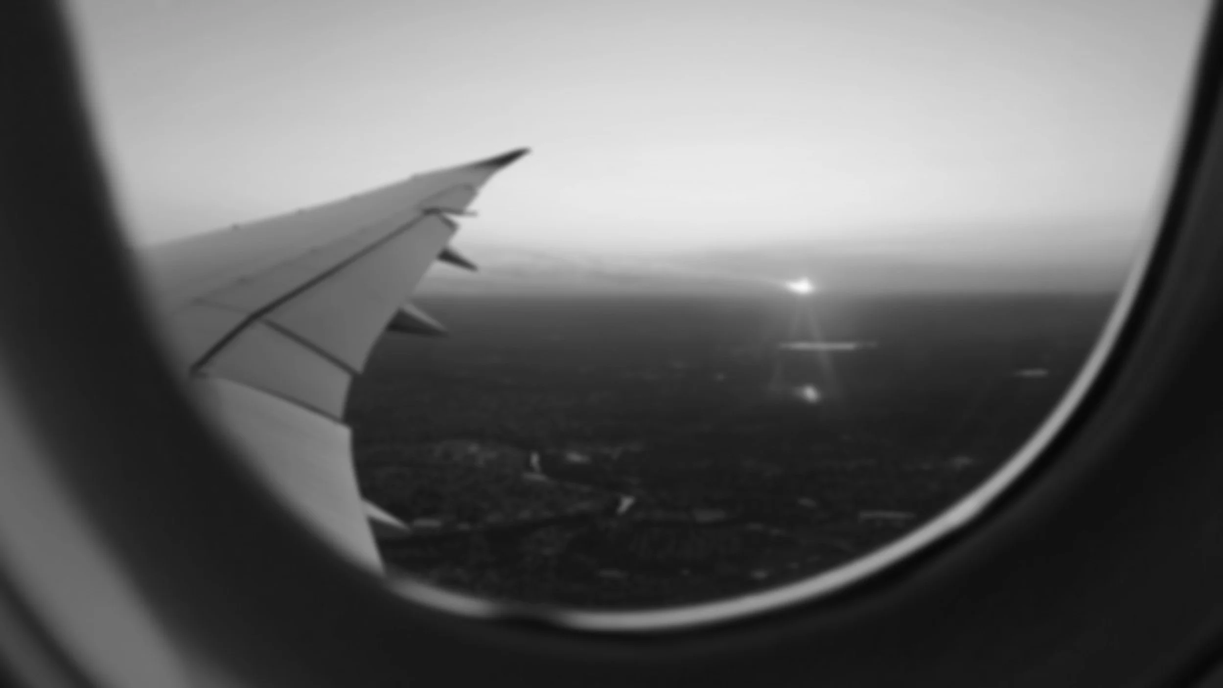 Blurry airplane window photo while traveling to a mission trip