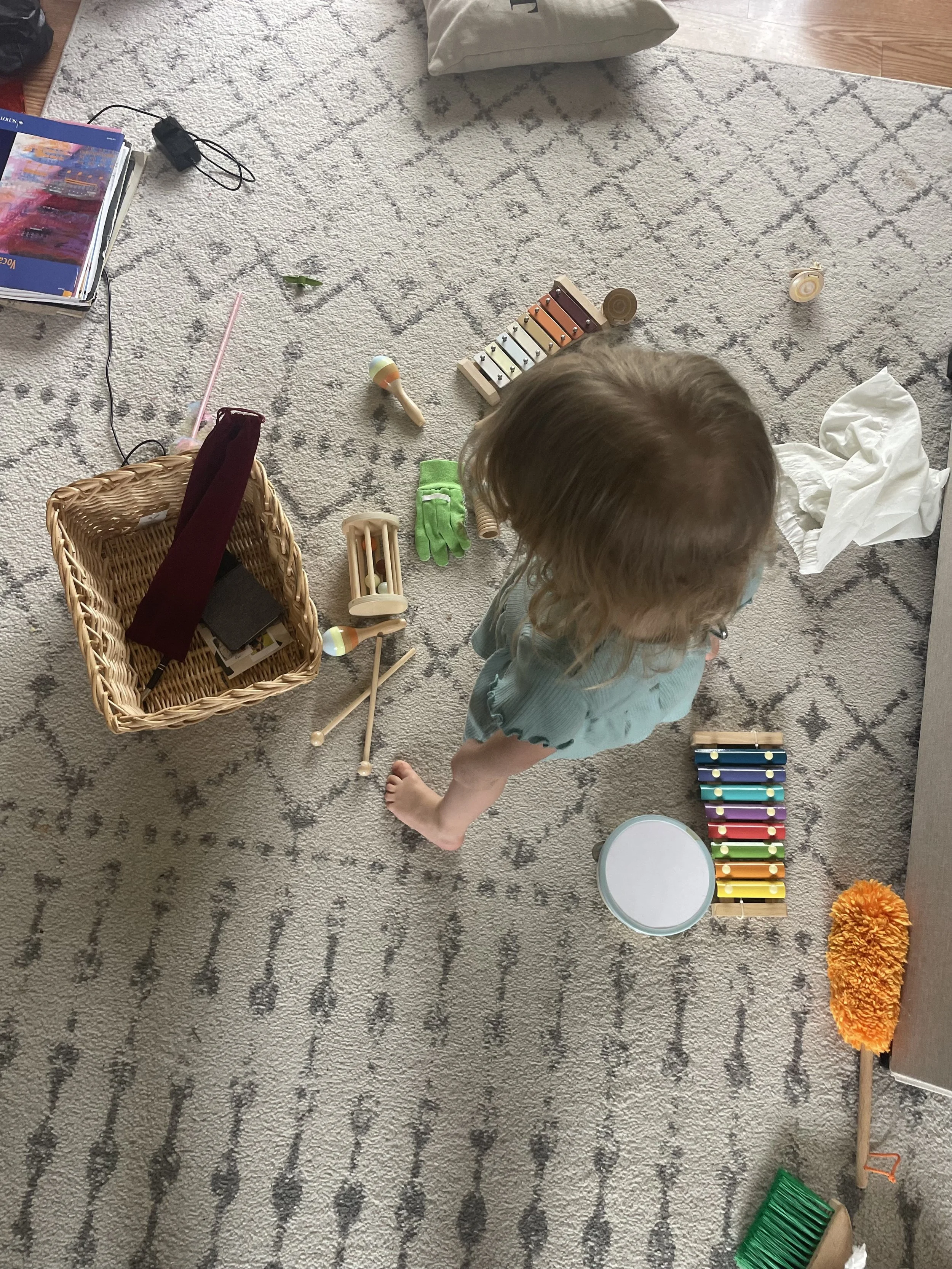 Toddler using worship music toys to engage in peaceful home music
