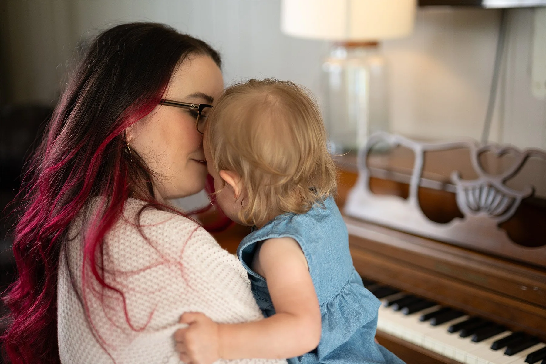 Mom and toddler reconnecting at piano after big feelings