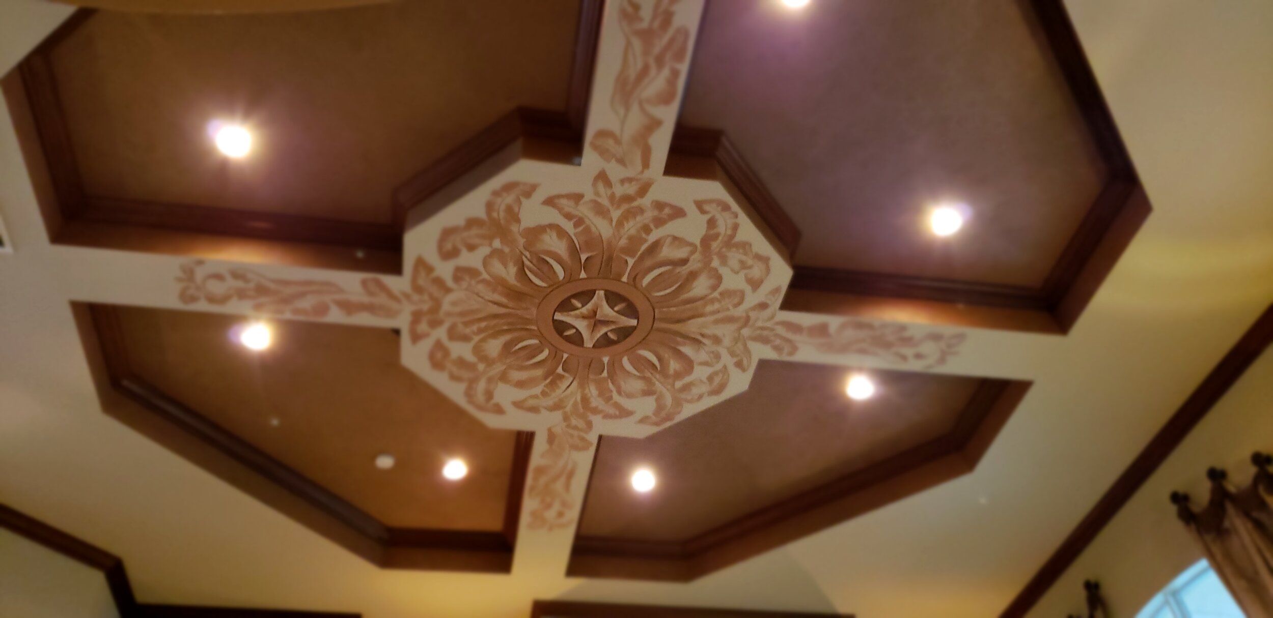 Faux finished ceiling with freehand stenciling