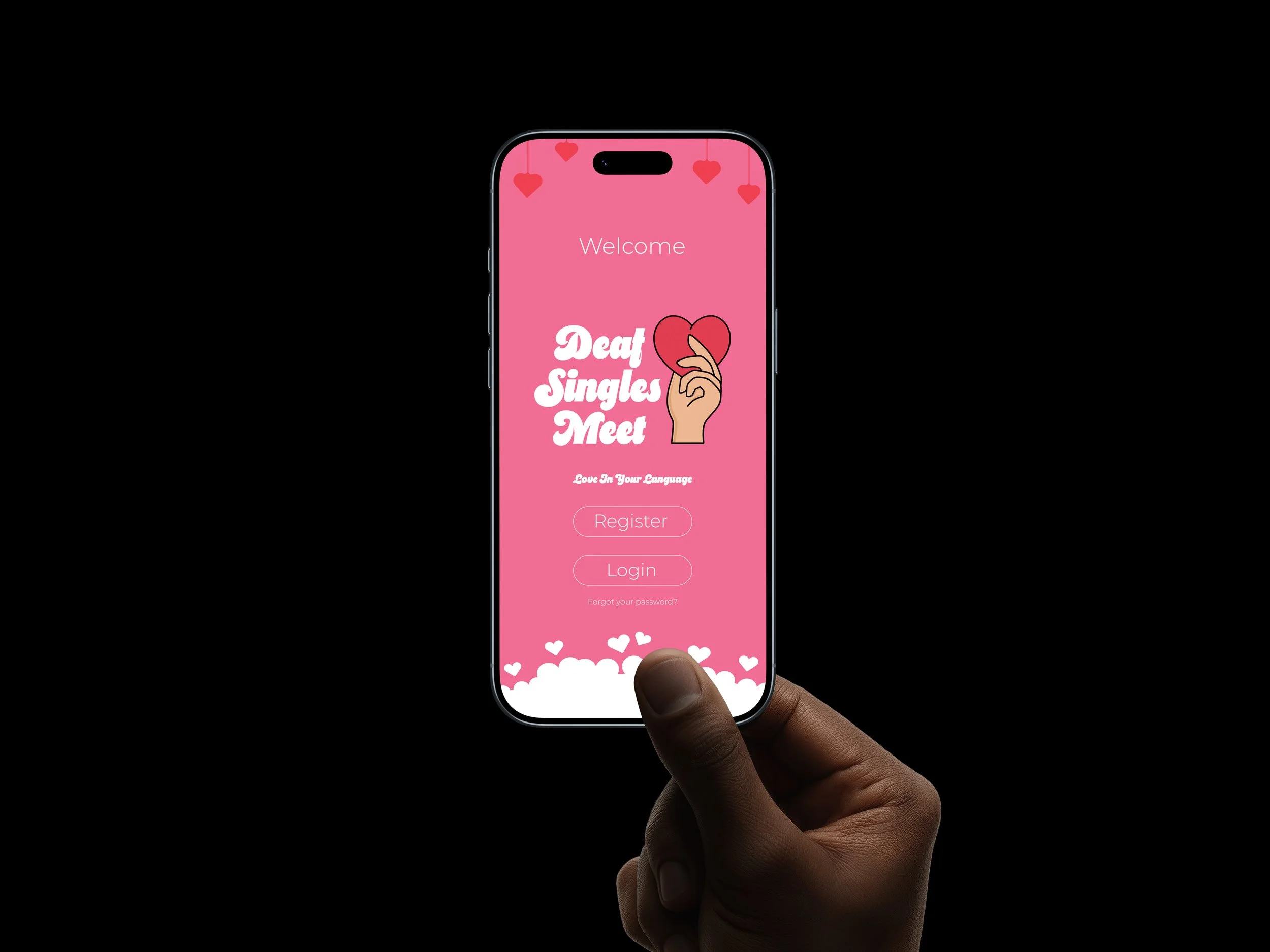 A person holding a smartphone with a pink registration screen for a dating app called 'Deaf Singles Meet' that features a hand-drawn heart held by a hand and small hanging hearts in the background.