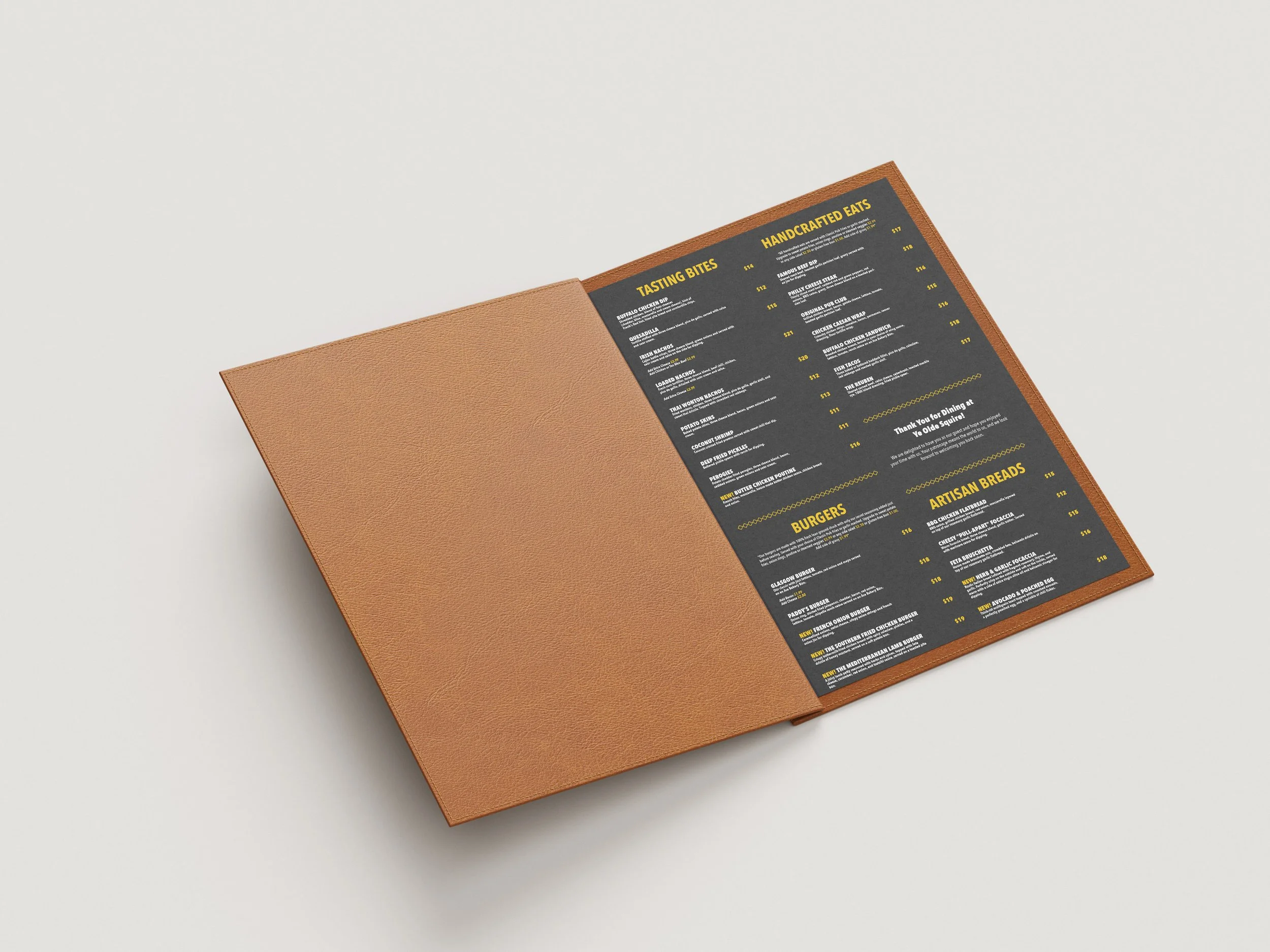 A restaurant menu inside a brown leather case, with black background pages and yellow text, seen from a corner tilted to the right on a plain white surface.