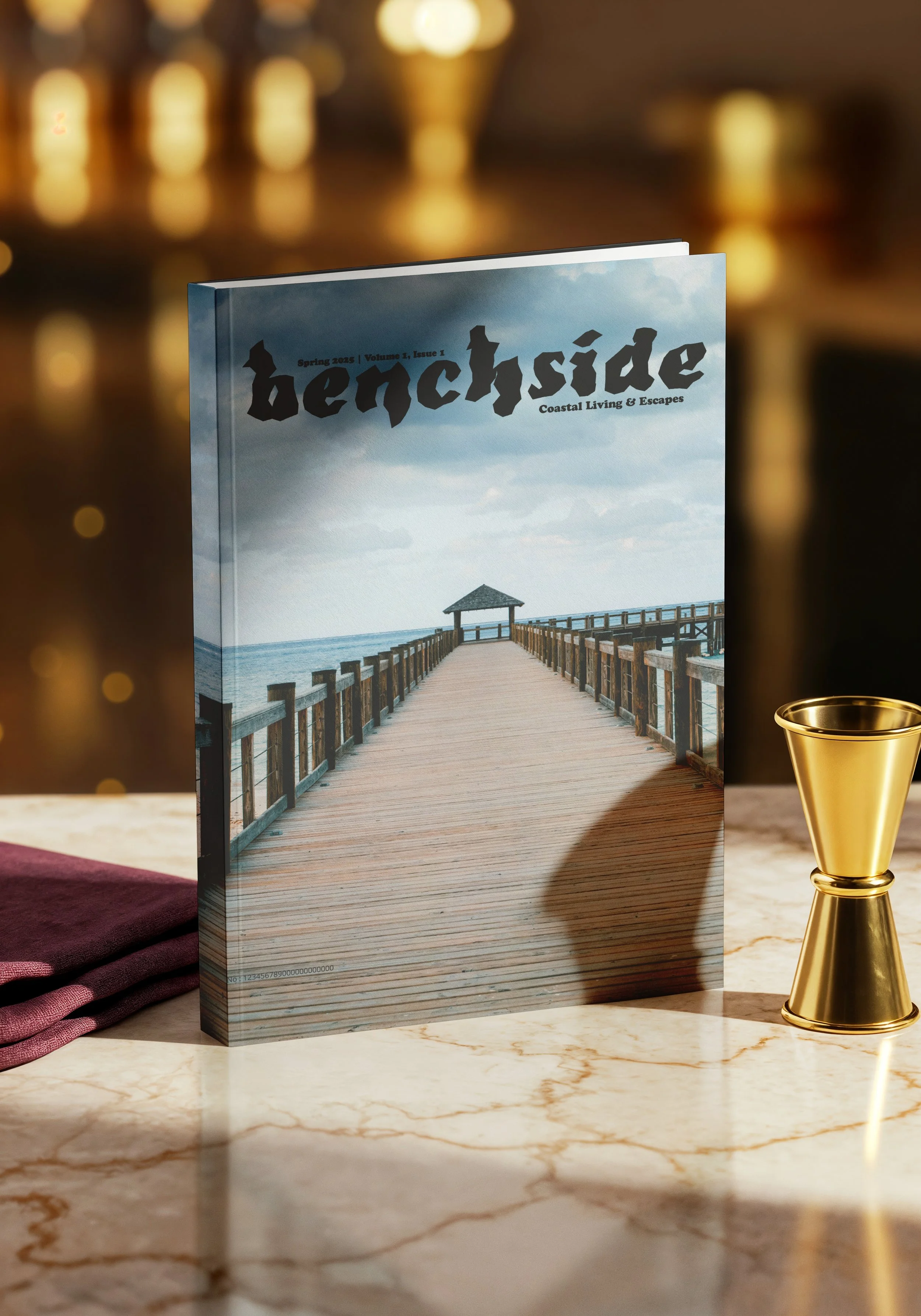 Magazine titled 'hencside' with cover photo of a pier extending over the ocean and cloudy sky.