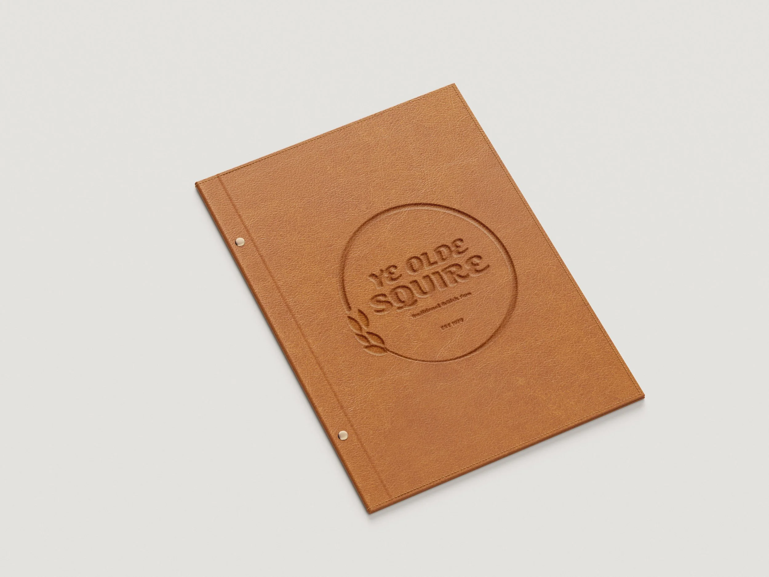 A terracotta-colored menu with embossed writing and a leaf logo on a white background.