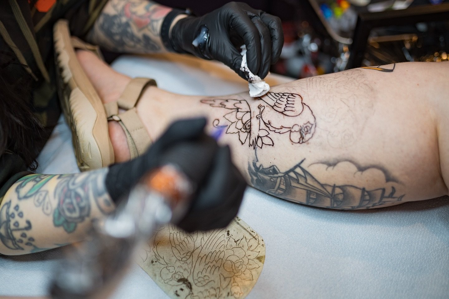 Emily working on a Sailor Jerry original flash. 
A friend and client brought it an old acetate stencil made by Jerry, and @emilyapolis got to do the honors of actually using it to place a graphite stencil on her.
Really fun to see part of the process