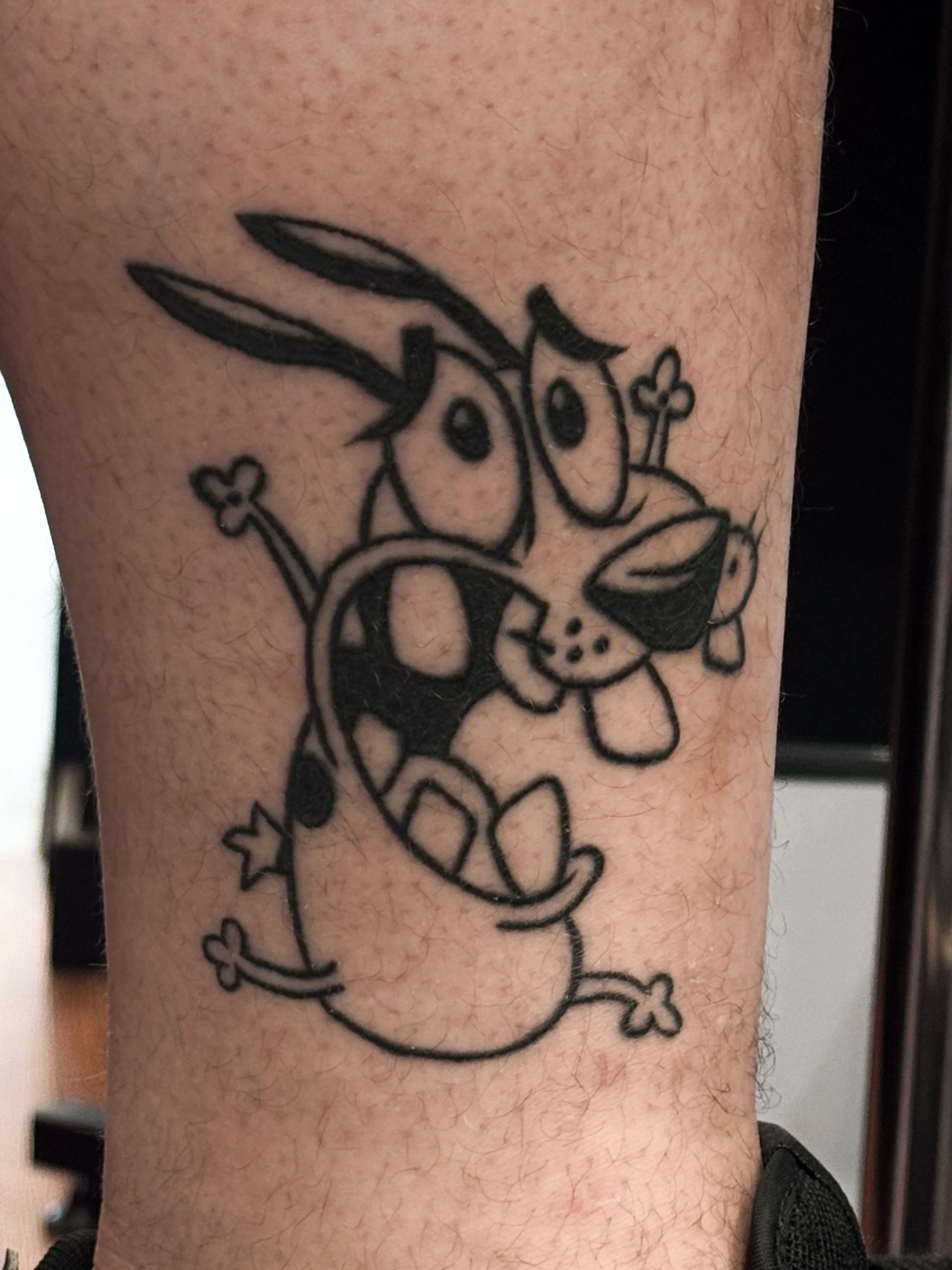 A tattoo of Daffy Duck on a person's leg.