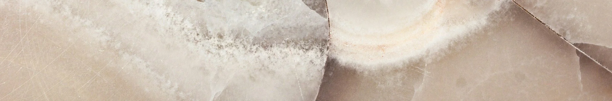 Close-up of torn brown paper with rough edges and creases.