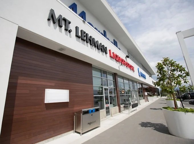 Exterior view of Liquor For Less at High Street Mall. Cheapest alcohol in British Columbia