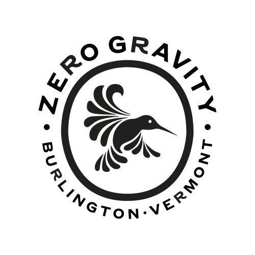 Logo for Zero Gravity Brewing featuring a stylized hummingbird inside a circular border with the brewery name.