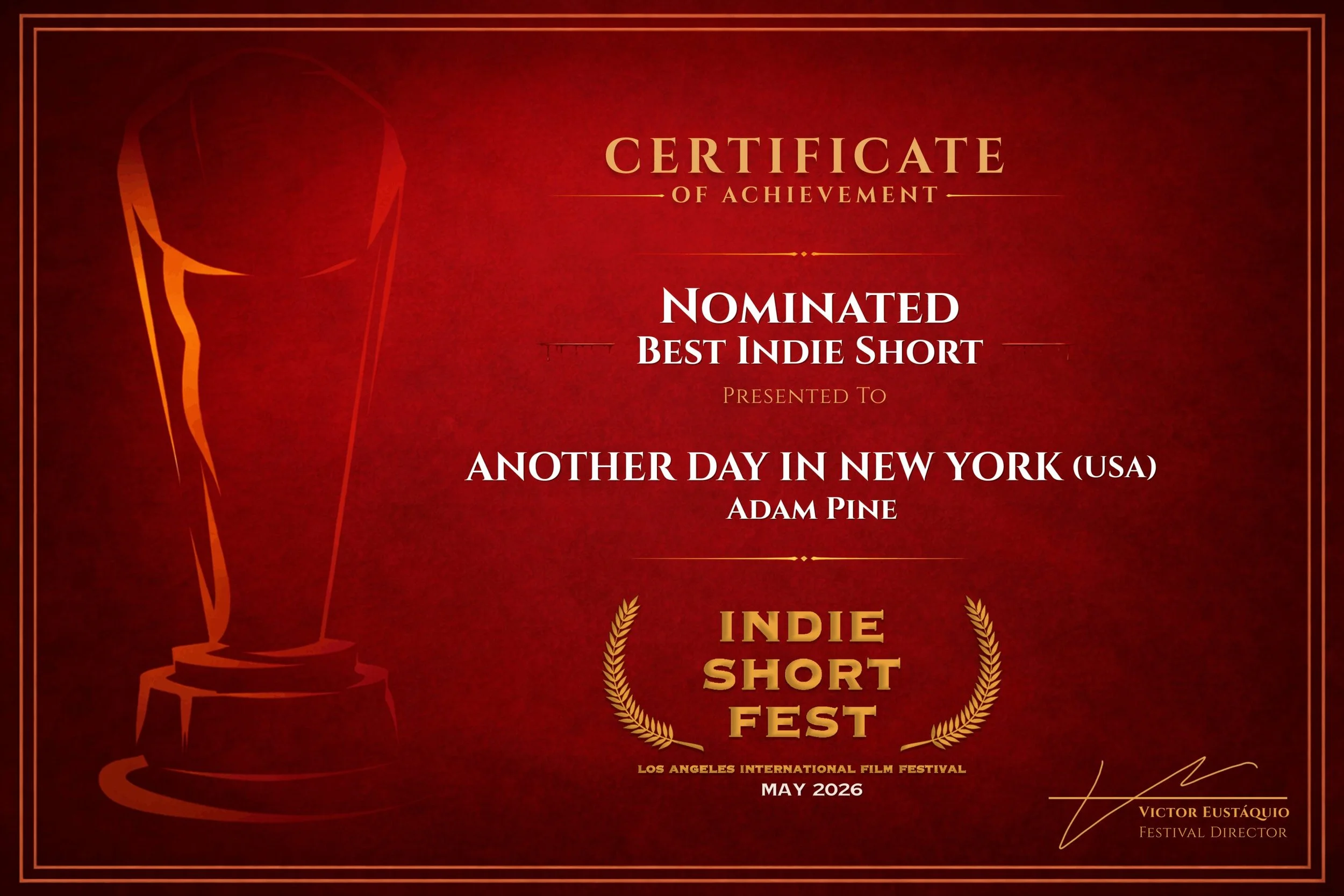 Certificate of achievement awarded to Adam Pine for being nominated for best indie short at the Indie Short Fest in Los Angeles in May 2026. The certificate has a red background with gold accents, an illustration of an award statue on the left, and decorative gold laurel wreaths on the bottom sides.