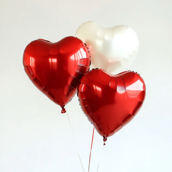 Red and white balloons shaped like hearts.