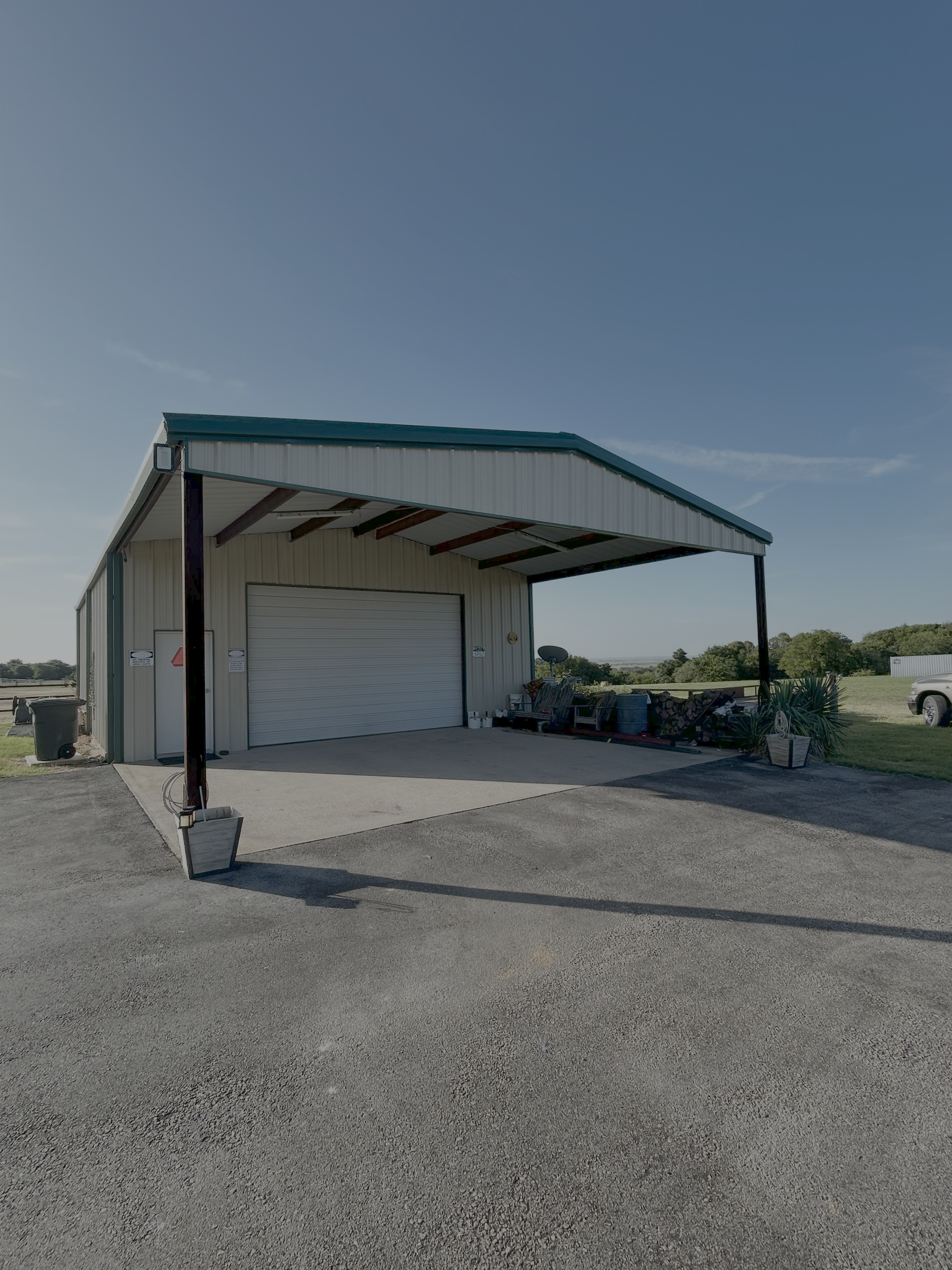 Metal overhang added to existing metal building.