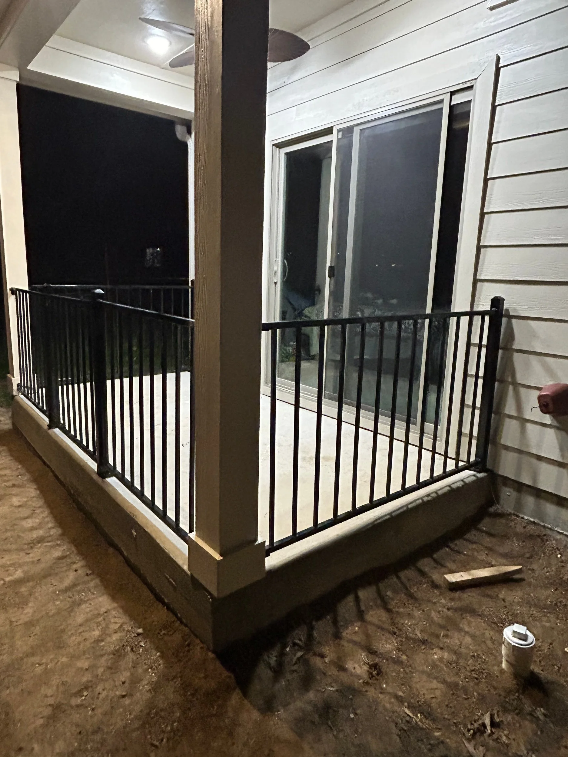 Residential metal porch railing installation by Spillers Metal Buildings.