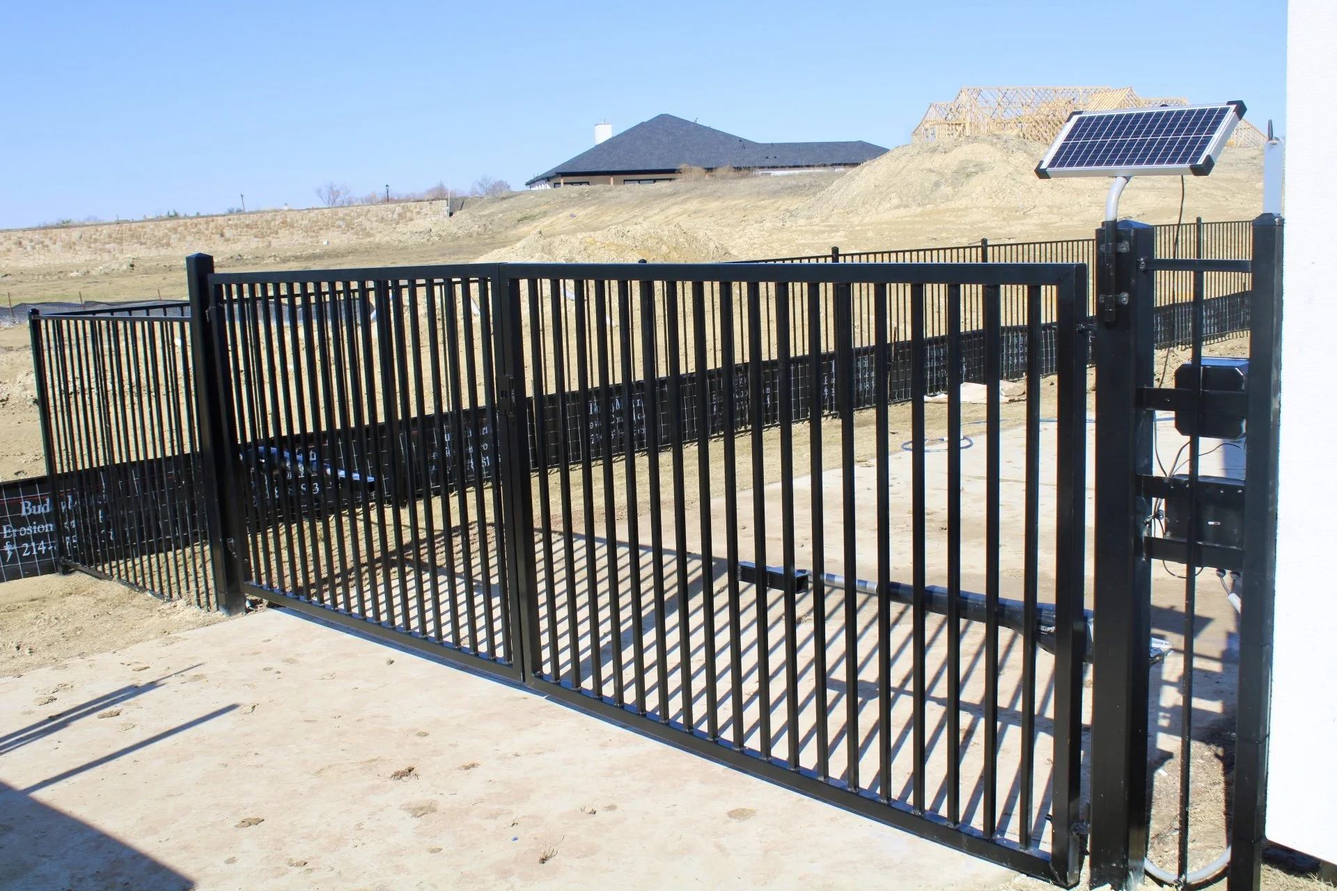 Residential metal fence and gate installation by Spillers Metal Buildings.