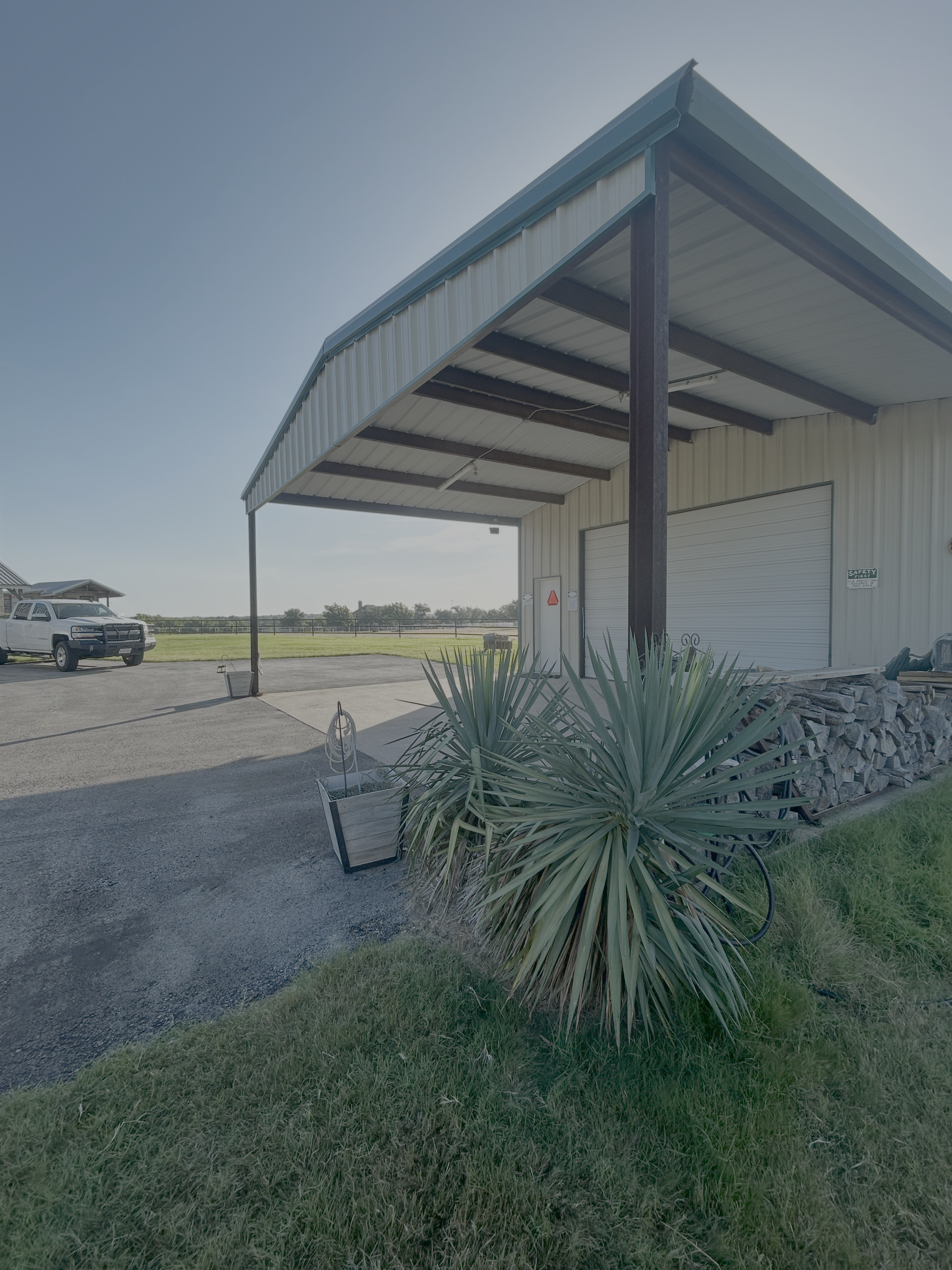 Metal overhang added to existing metal building.