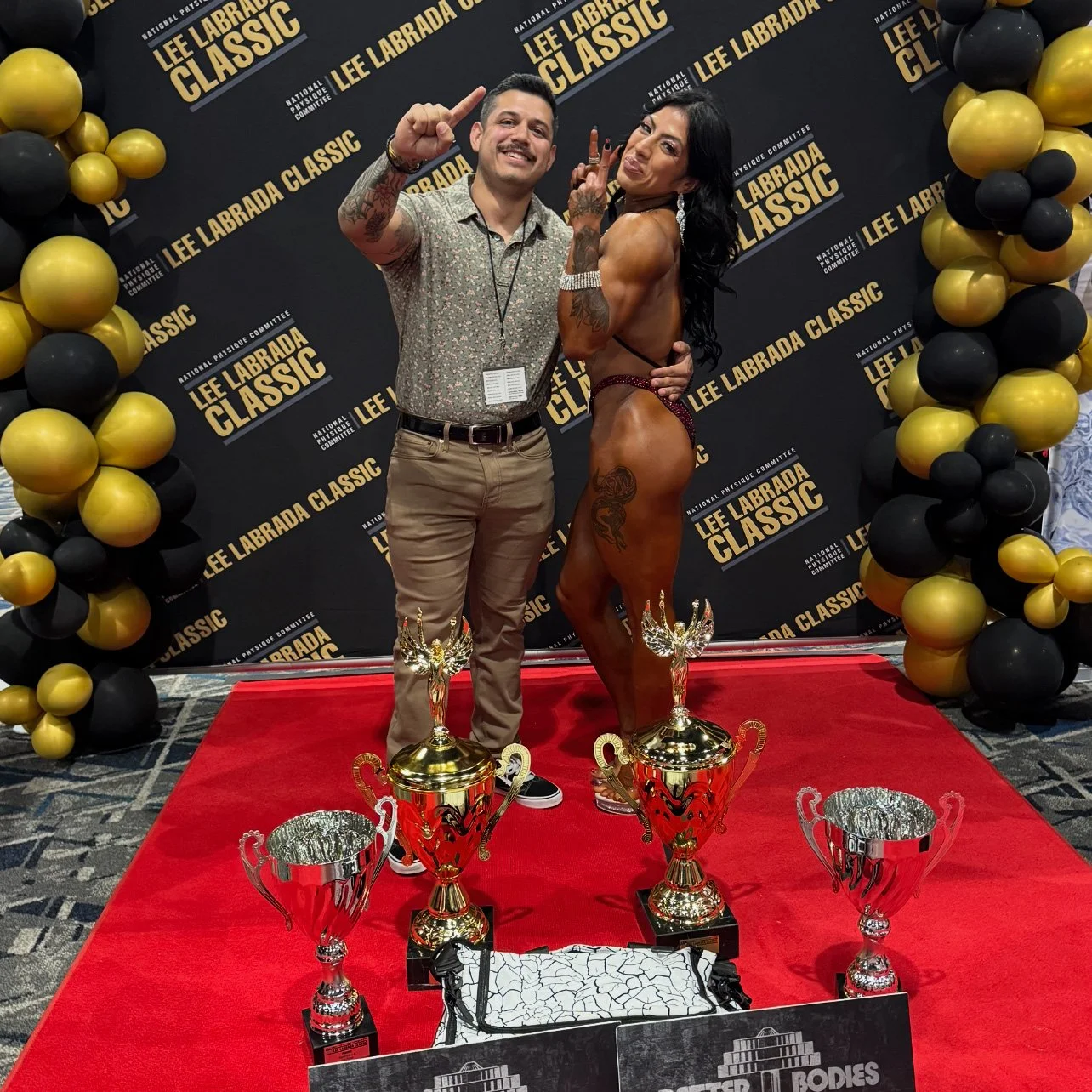 tony and competitor with trophies.jpg