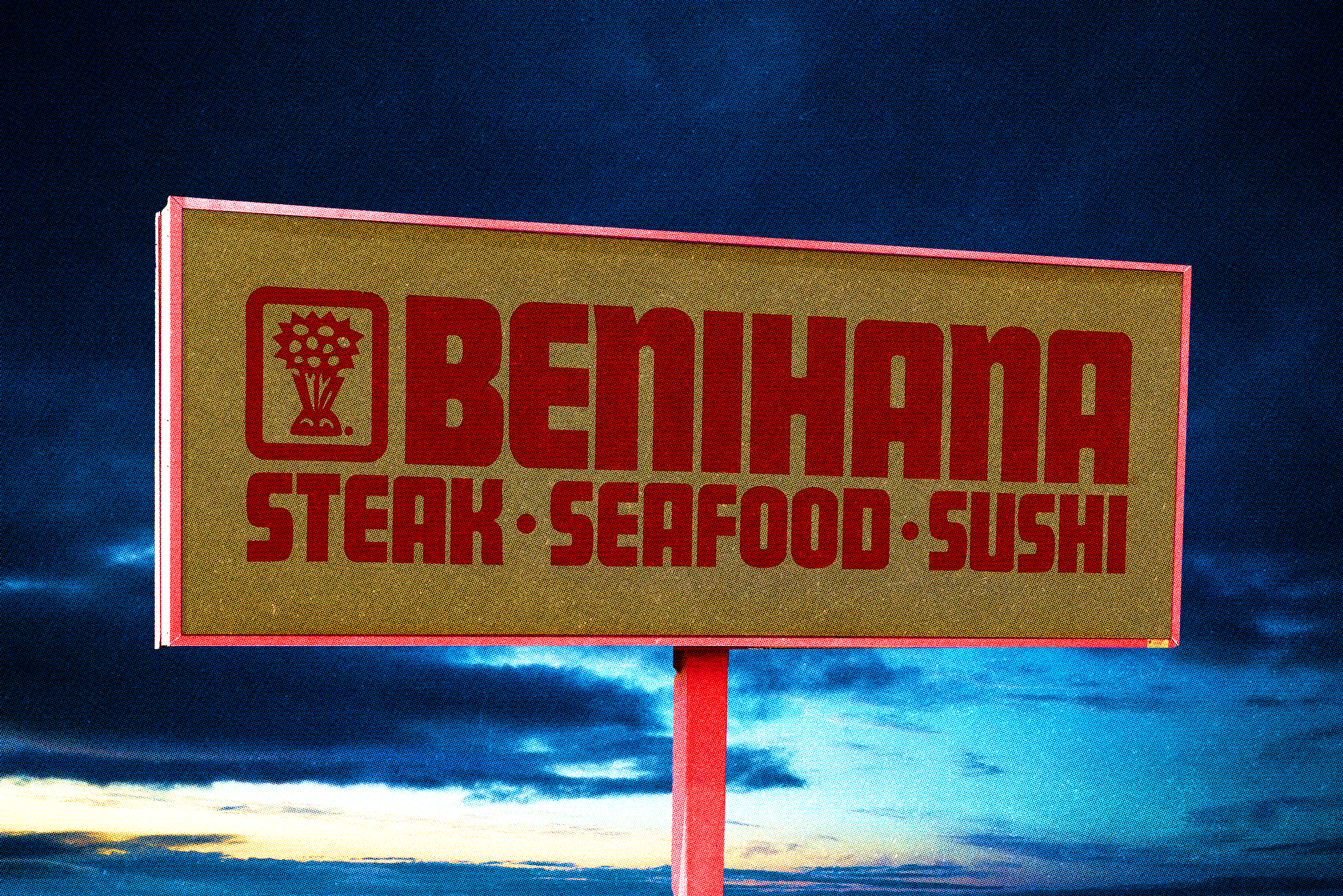 A roadside sign advertising beef, steak, seafood, and sushi against a cloudy sky at sunset.