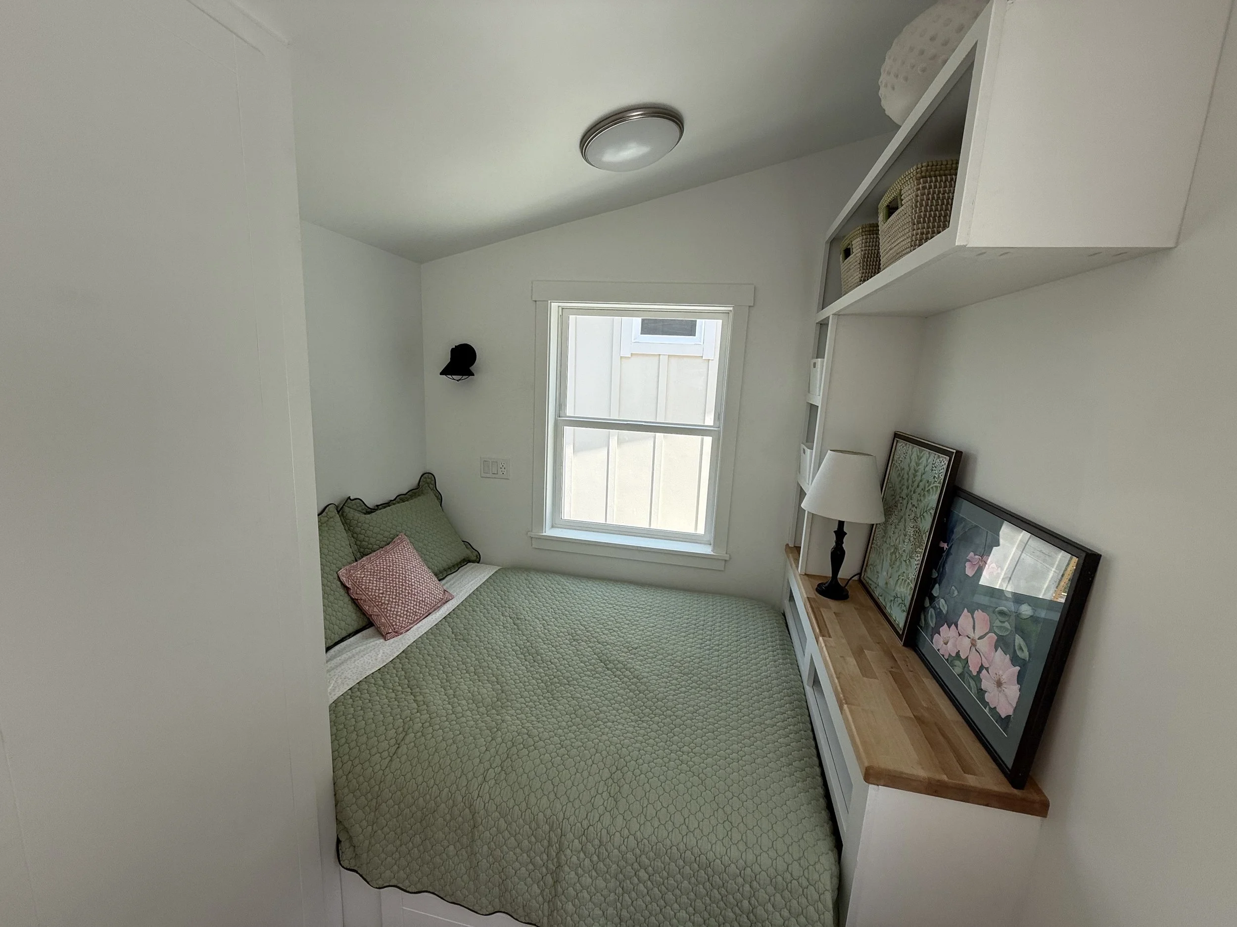 Full Bed,
Large Custom drawers,
Entertainment unit,
Shelves, and
Closet