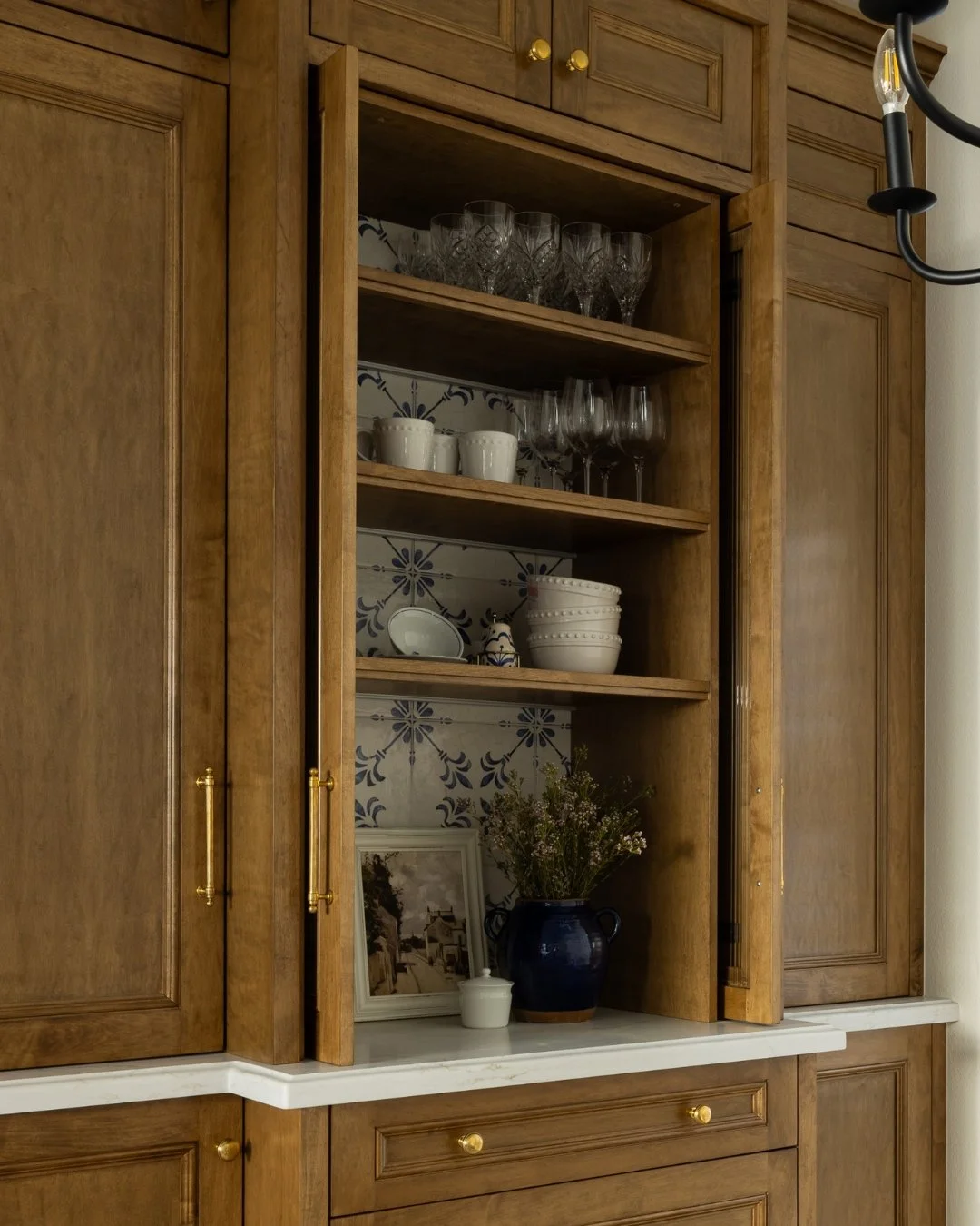 This piece&hellip; countless hours spent refining every detail&mdash;from the proportions within the space, to the function, the hardware, the stain, and the finish. Layering materials like tile and reeded glass, and integrating soft LED lighting ben