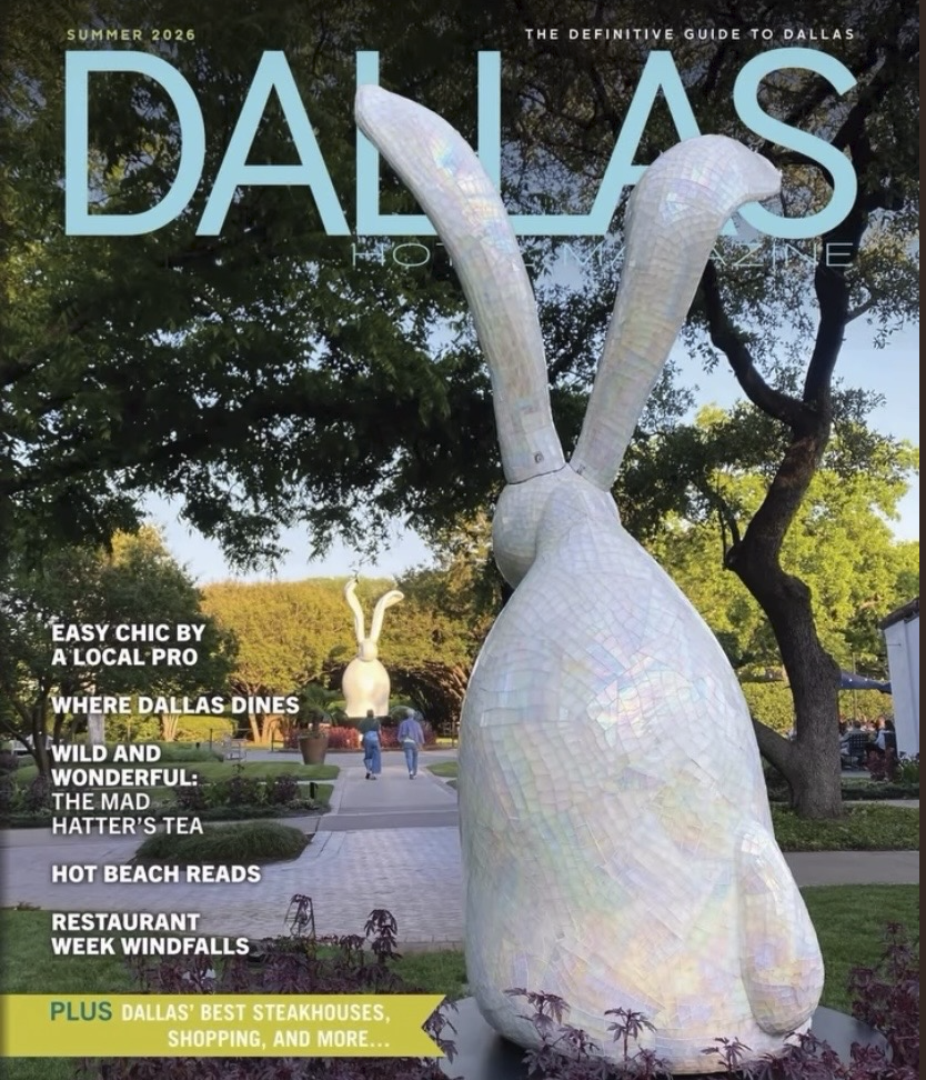 Magazine cover featuring large, white, iridescent rabbit sculptures with tall ears, set in a park with trees and a pathway, titled "DALLAS."