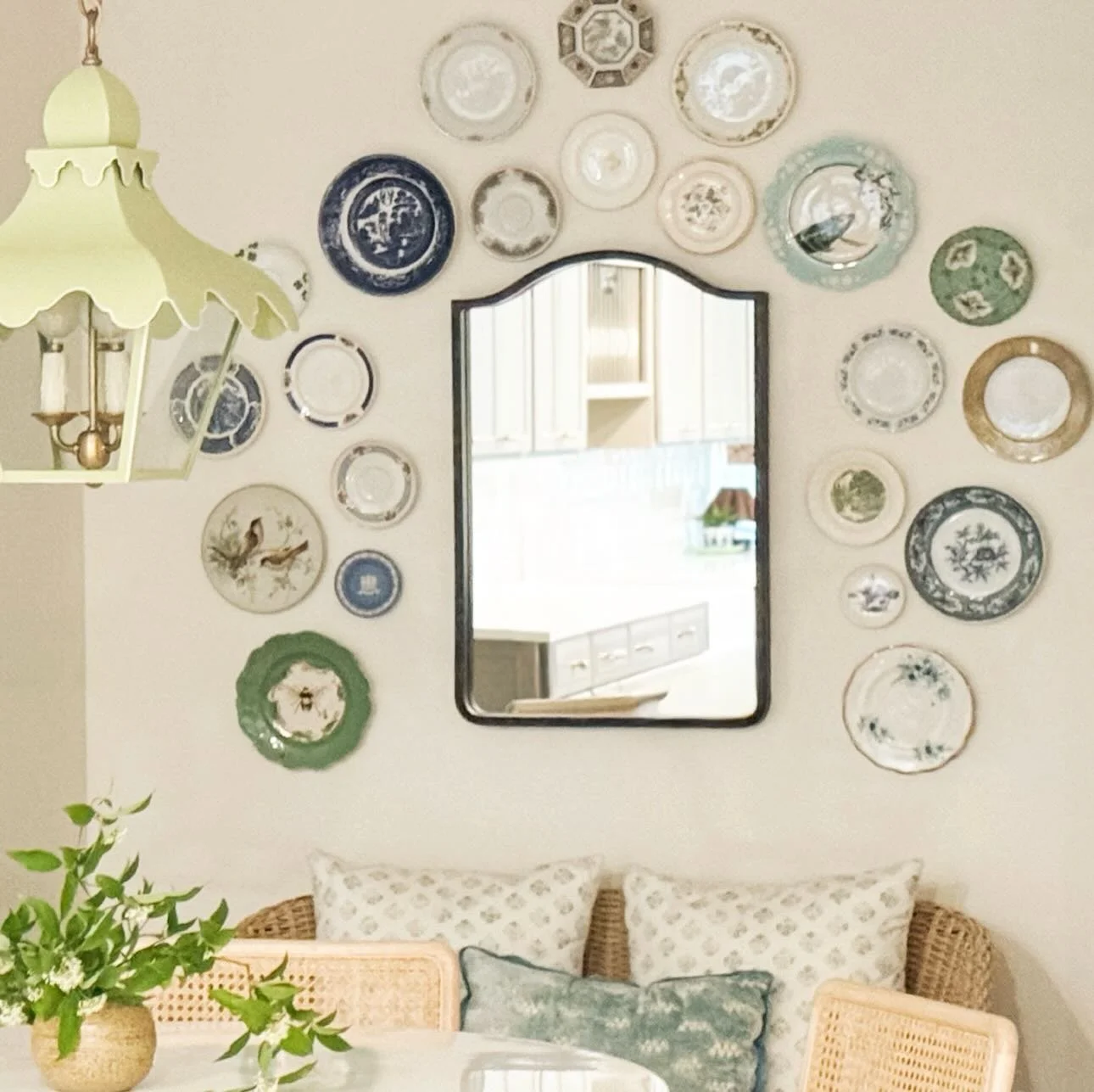 One of the things I pay attention to when designing a room is repetition. A room feels cohesive when shapes, colors, or materials appear more than once.

In this dining space, the fan shape in the pendant echoes the scalloped plate, while the gentle 