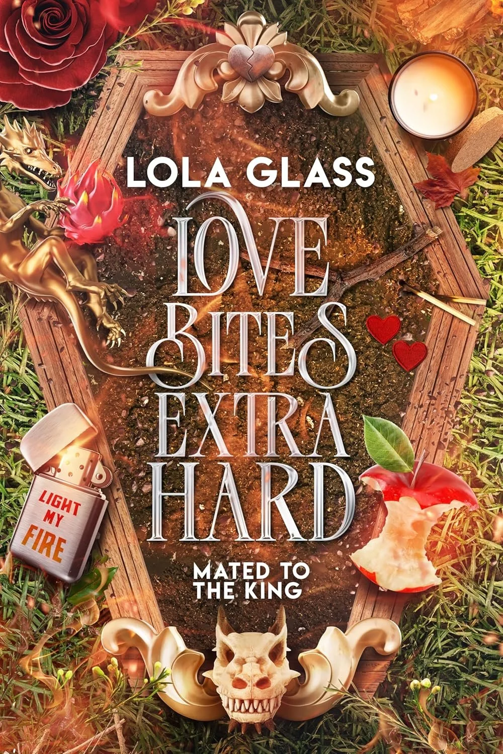 Book cover titled 'Love Bites Extra Hard' by Lola Glass, featuring a grave decorated with a skull, dragon figurine, apples, hearts, candle, and fire-themed elements with fiery and dark colors.